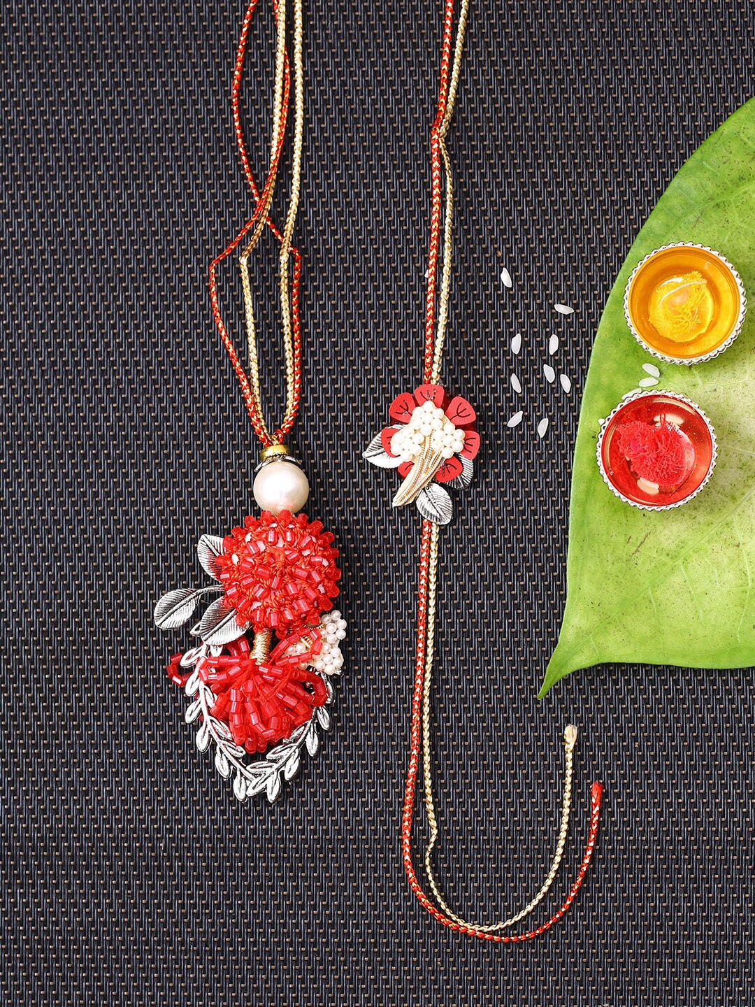 

Aapno Rajasthan Red Stone-Studded Bhaiya Bhabhi Rakhi Set