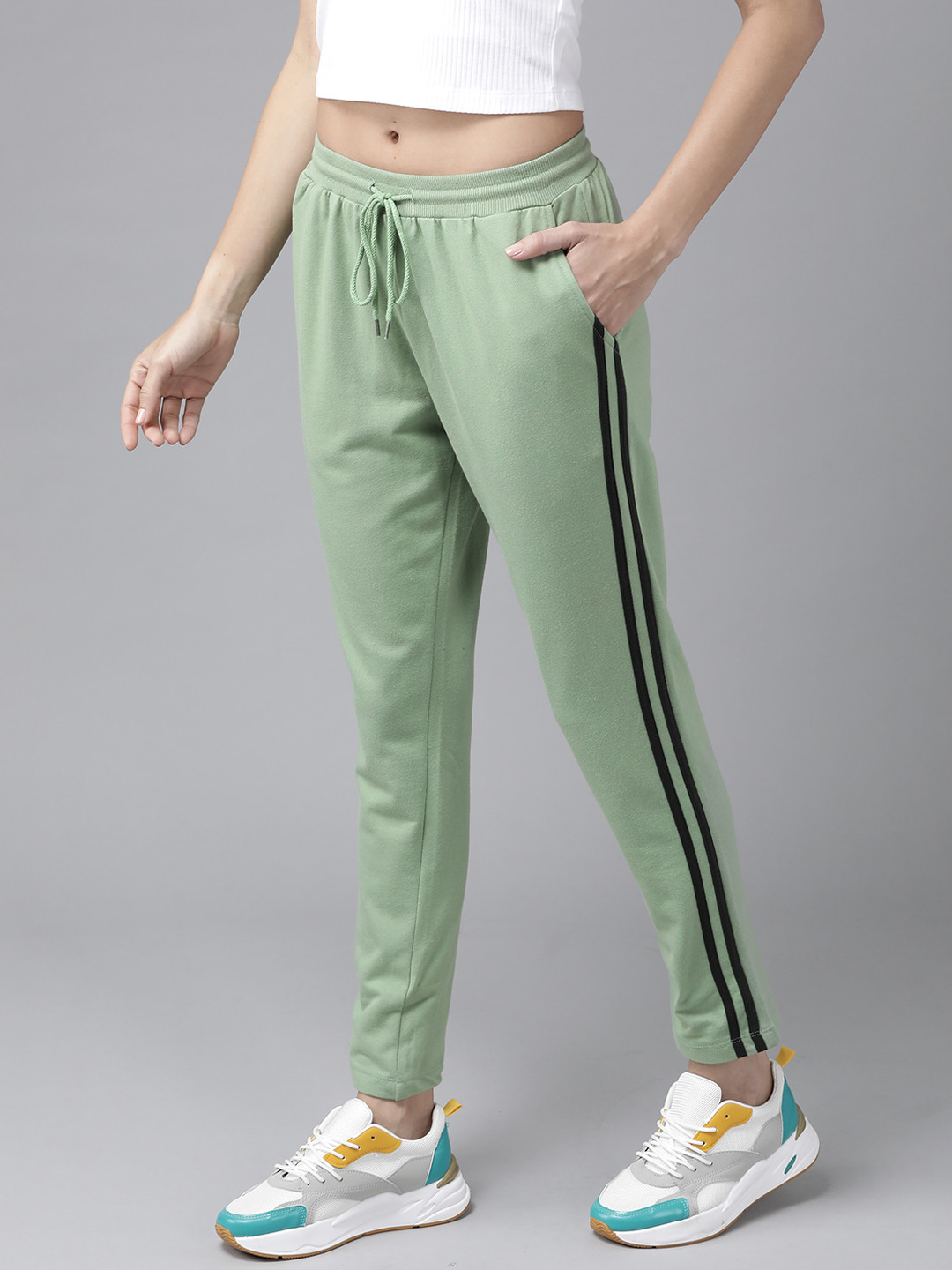 

Roadster Women Green Solid Cropped Track Pants With Side Stripes