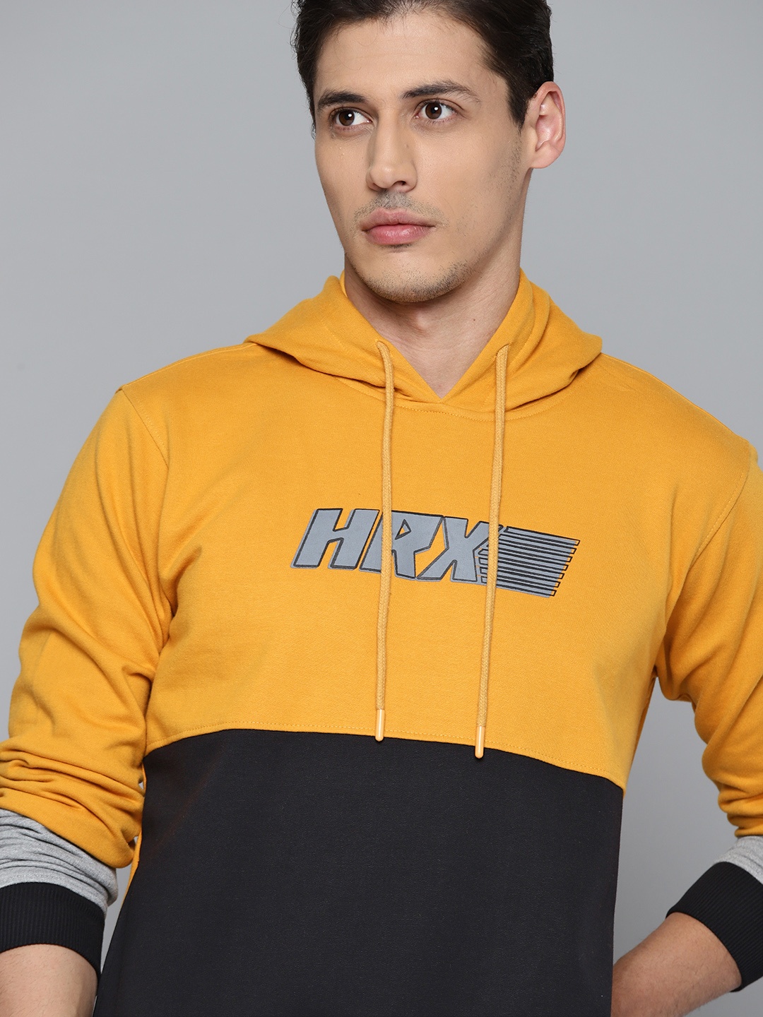 

HRX By Hrithik Roshan Lifestyle Men Black Rapid-Dry Colourblock Sweatshirts, Mustard