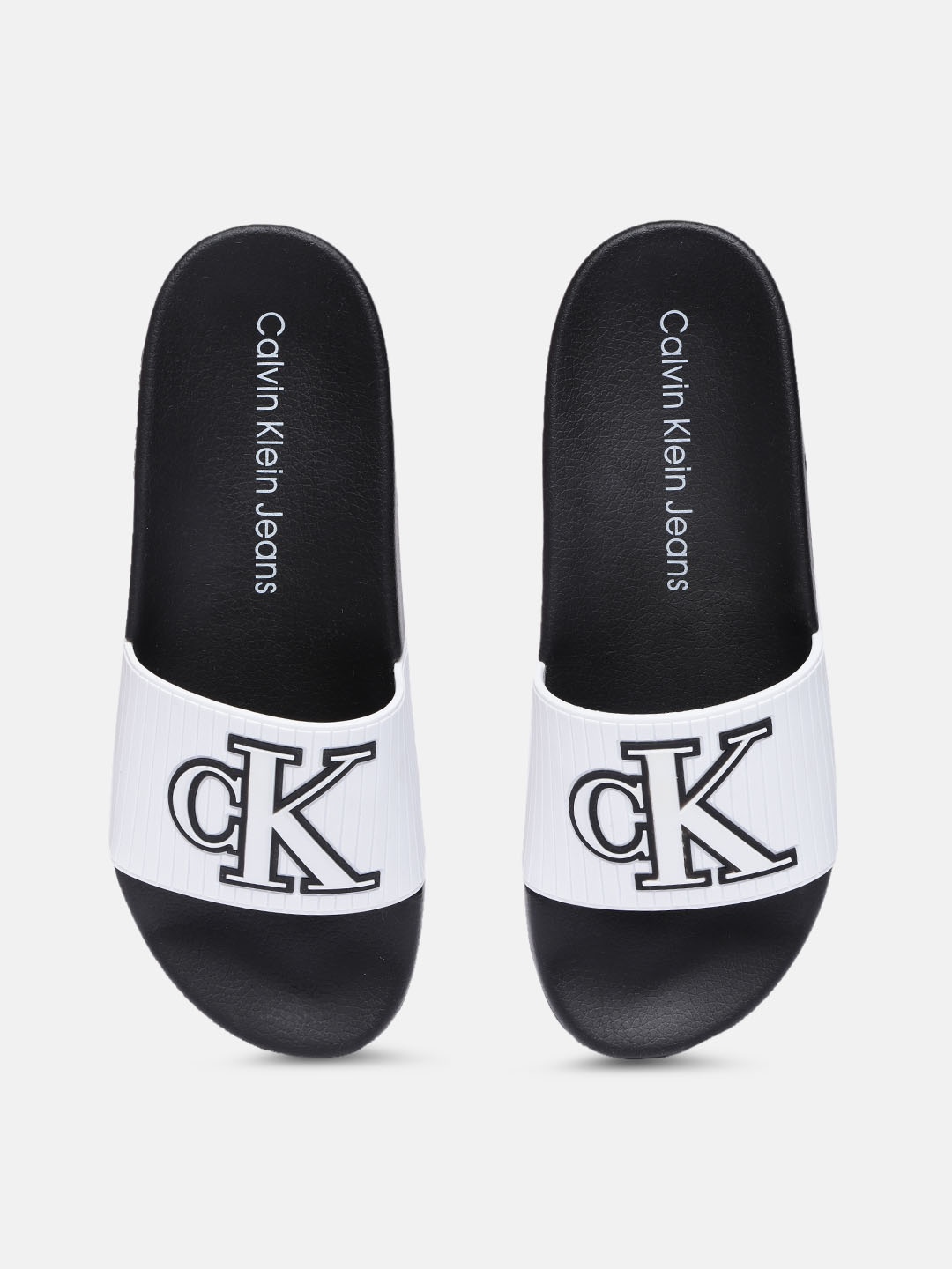 

Calvin Klein Men White & Black Self Design Sliders