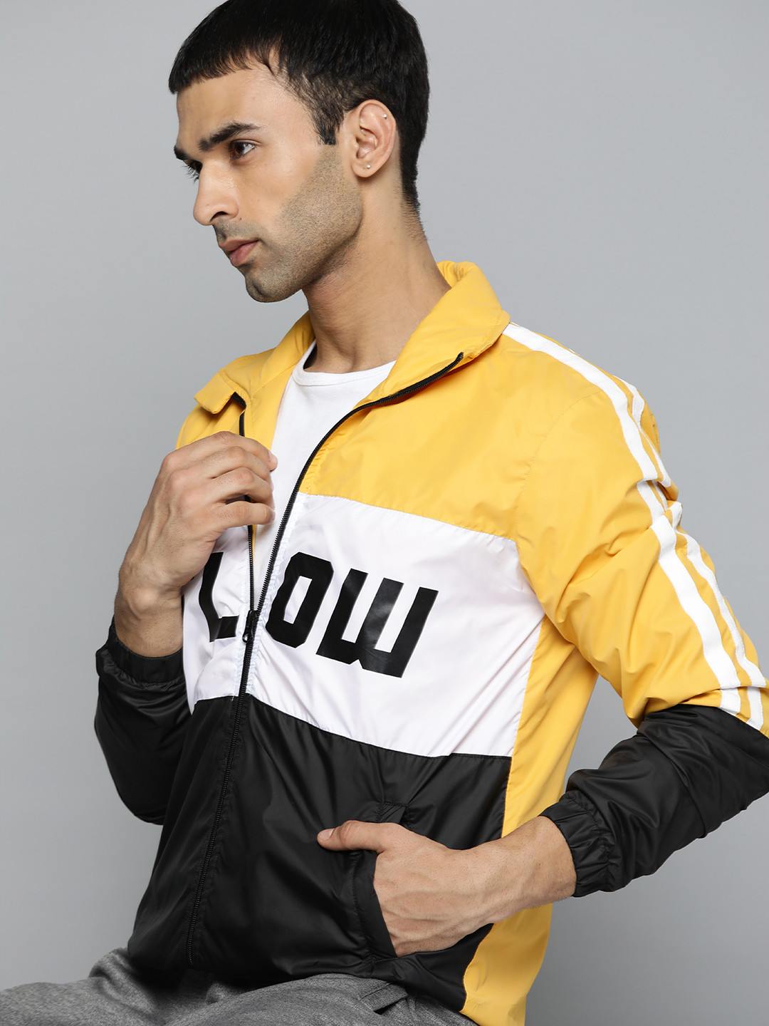 

HRX by Hrithik Roshan Men Yellow & White Colourblocked Sporty Jacket