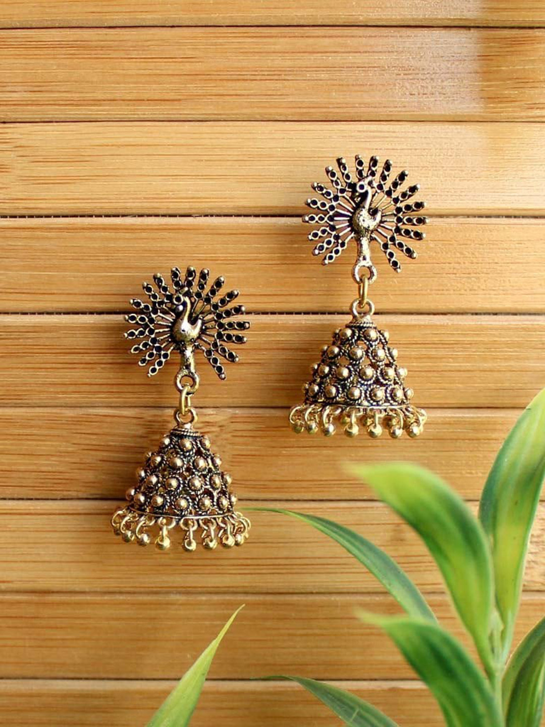 

Priyaasi Gold-Toned Oxidized Peacock Shaped Jhumkas Earrings