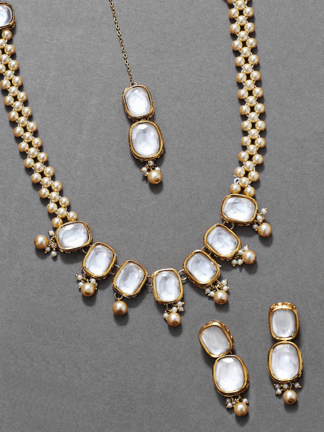 

KARATCART Gold-Plated White & Beige Kundan-Studded & Pearl Beaded Polki Handcrafted Jewellery Set