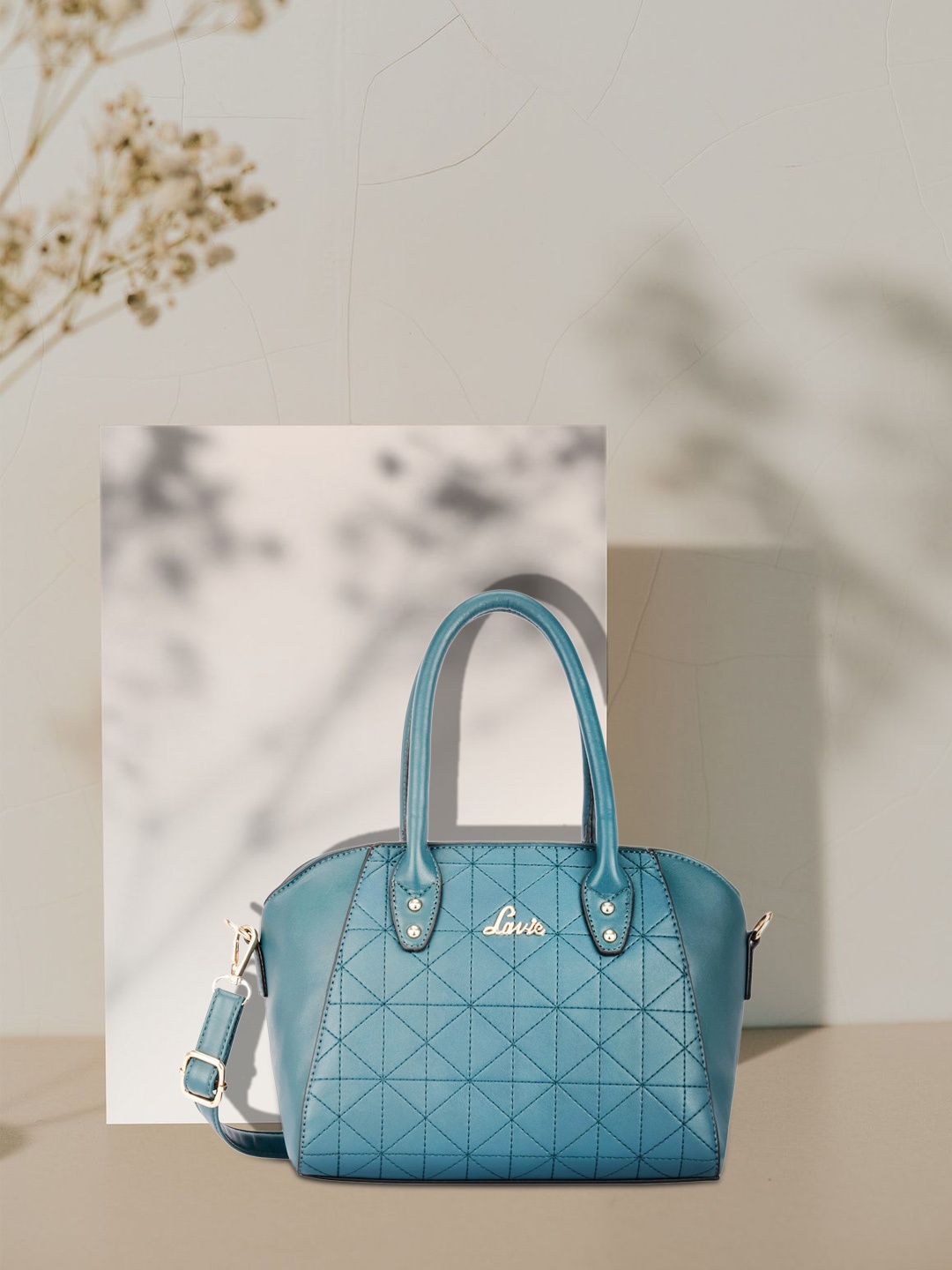 

Lavie Teal Green Geometric Textured SIRIUS DLX Handheld Bag