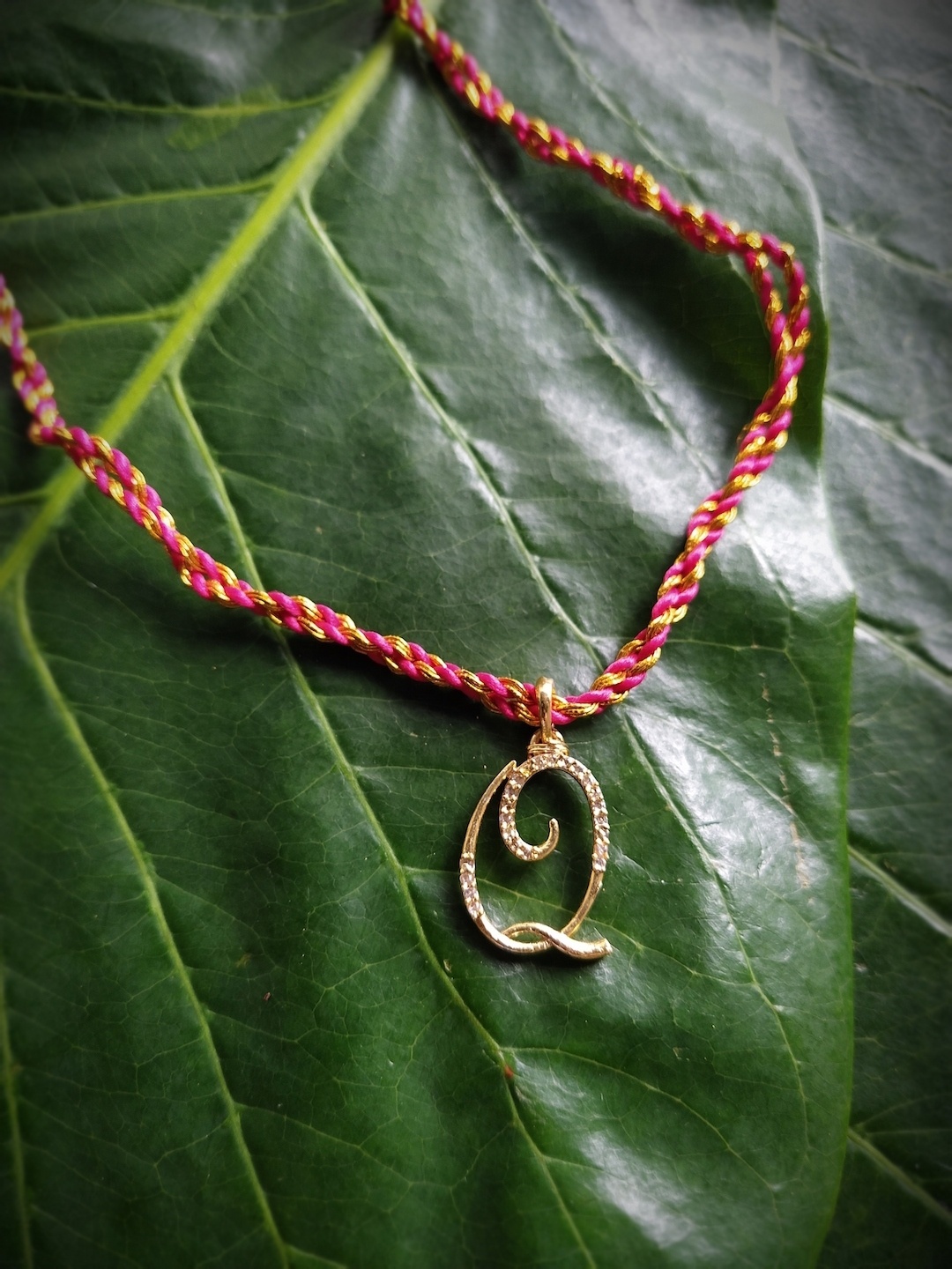 

Digital Dress Room Gold Plated Letter Q Customized AD Pendant Rakhi