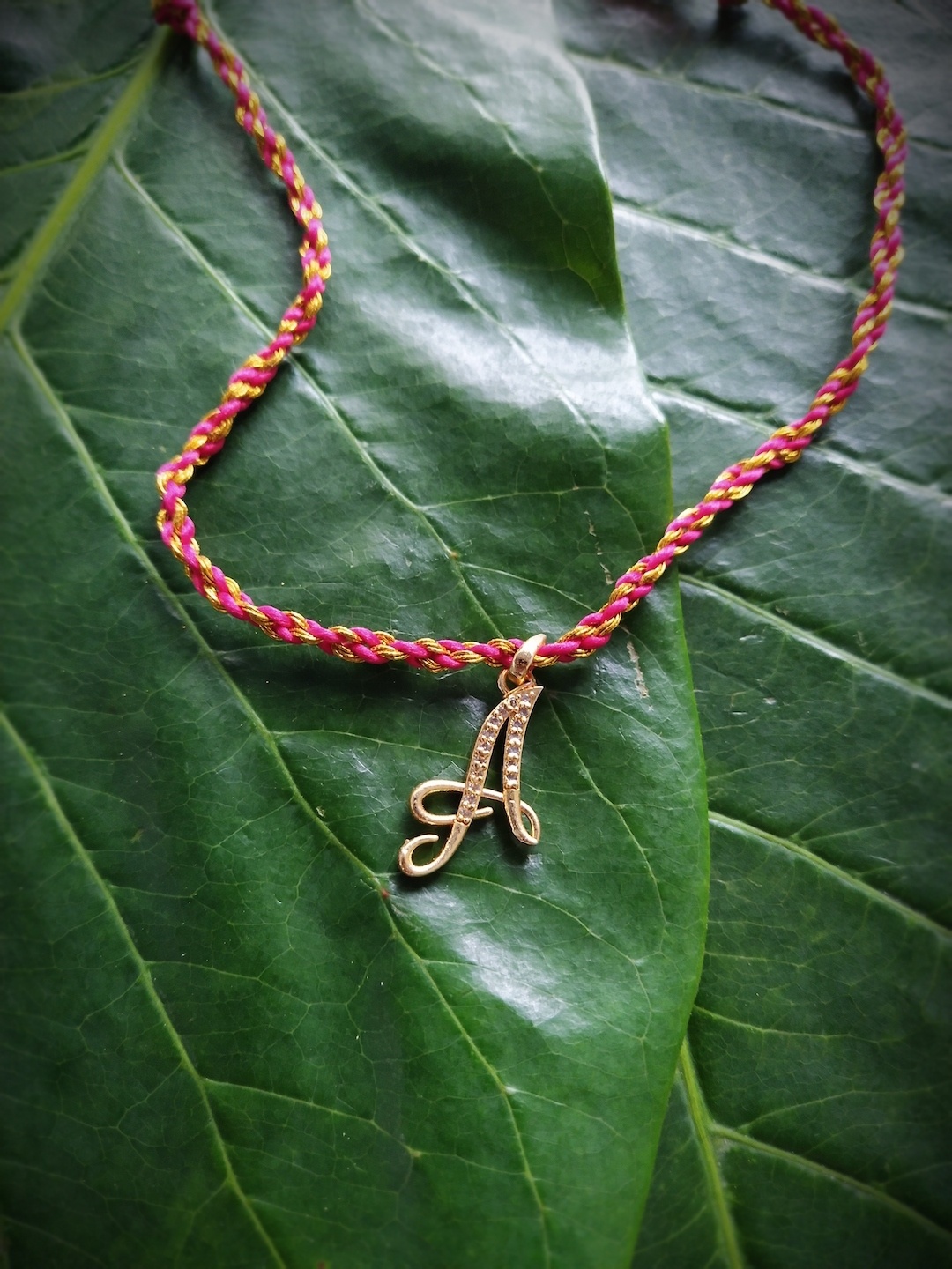 

Digital Dress Room Men Gold-Plated & Cream-Coloured & Gold-Toned AD-Studded Alphabet A Rakhi