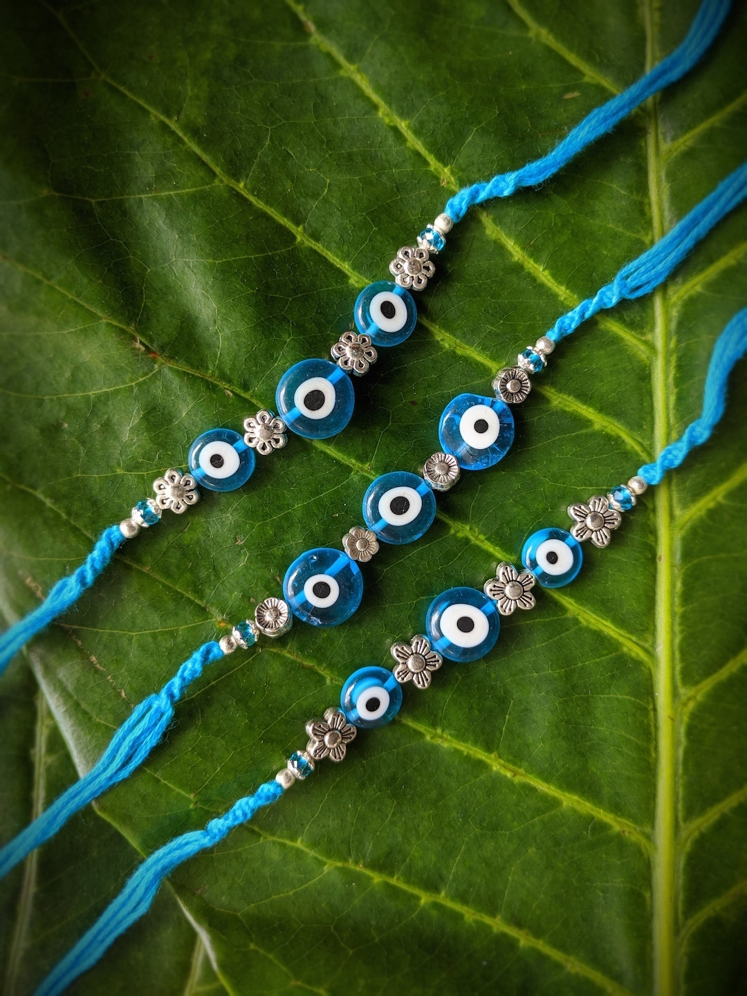 

Digital Dress Room Men Set Of 3 Silver-Toned & Blue Evil Eye Rakhi