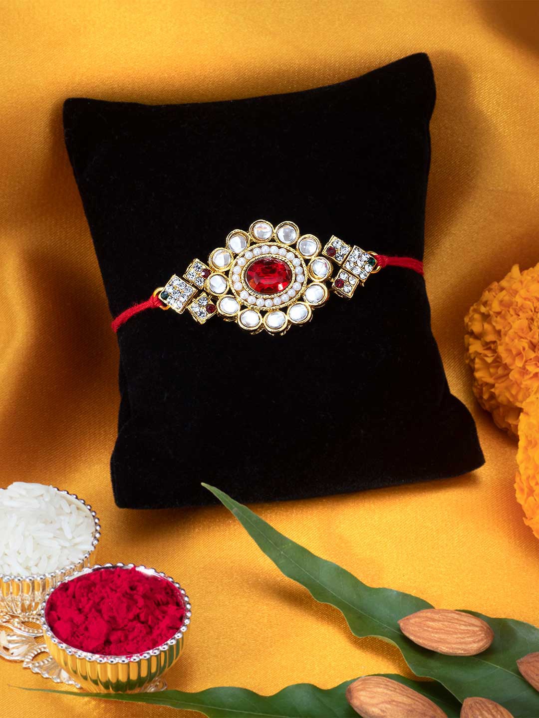 

Peora Men Gold-Toned Red Kundan & Crystal-Studded Rakhi With Greeting Card & Roli Chawal