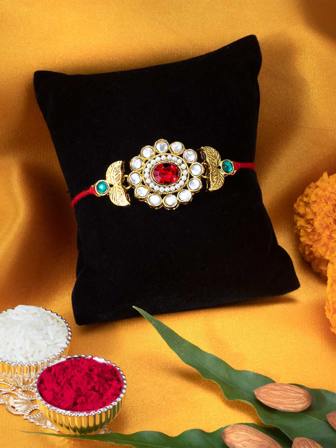 

Peora Gold Plated Kundan Leaf Rakhi with Raksha Bandhan Greeting Card & Roli Chawal