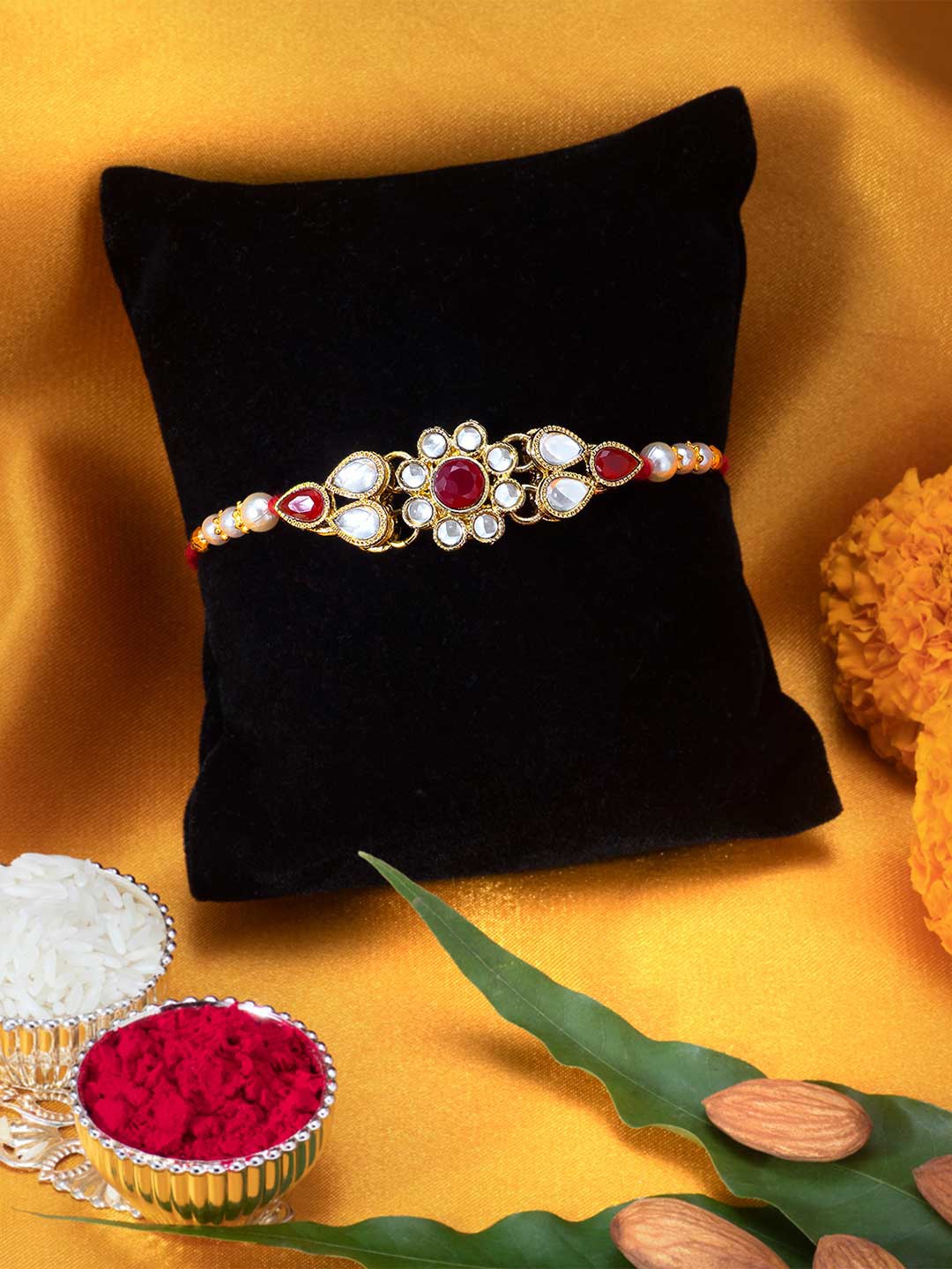 

Peora Gold-Toned Kundan Stone Rakhi with Raksha Bandhan Greeting Card & Roli Chawal