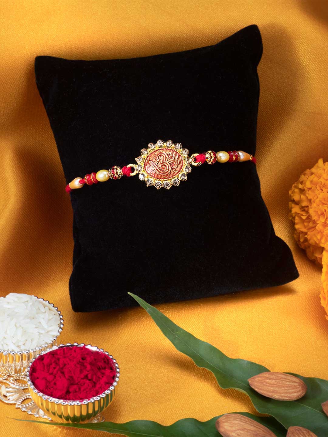 

Peora Red Om Rakhi With Greeting Card & Roli Chawal