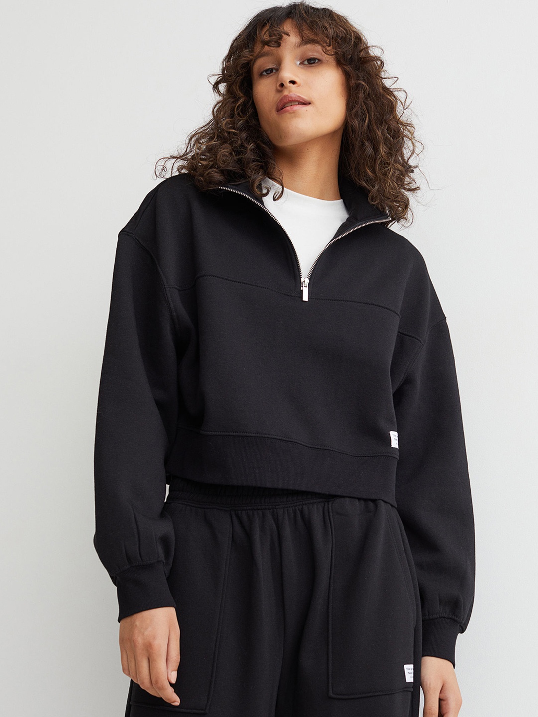 

H&M Women Black Solid Zip-Top Sweatshirt