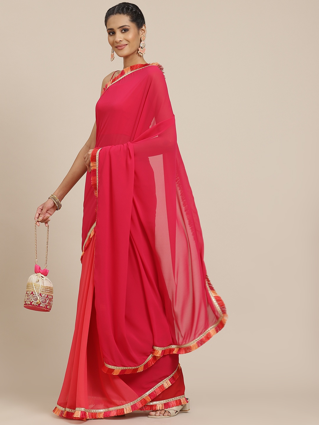 

Sangria Pink Solid Saree with Tasselled Detail