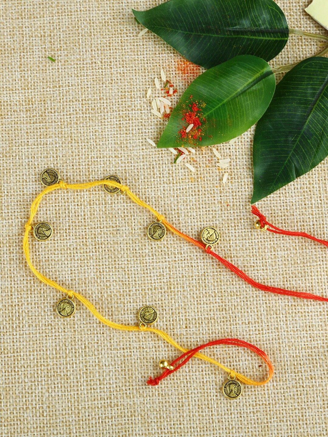 

Aapno Rajasthan Handcrafted Mauli Rakhi with Hanging Small Golden Ancient Style Coins, Red