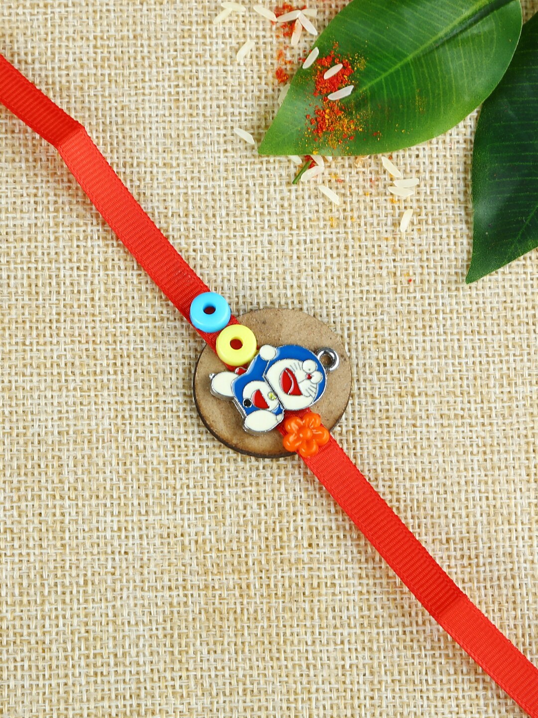 

Aapno Rajasthan Kids Red & Blue Animated Doraemon Cartoon Rakhi