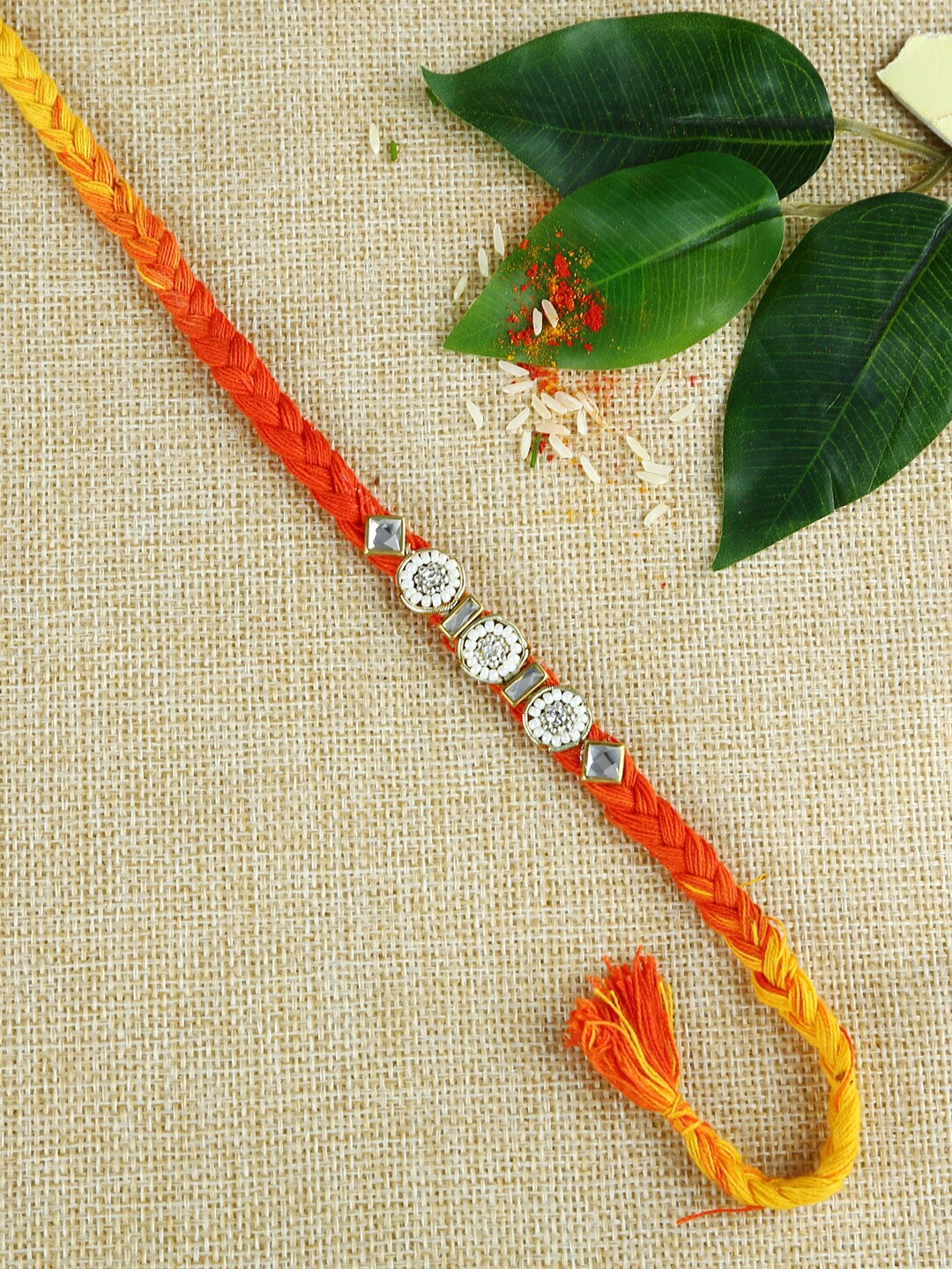 

Aapno Rajasthan Multicoloured Handcrafted Braided Mauli Rakhi, Red