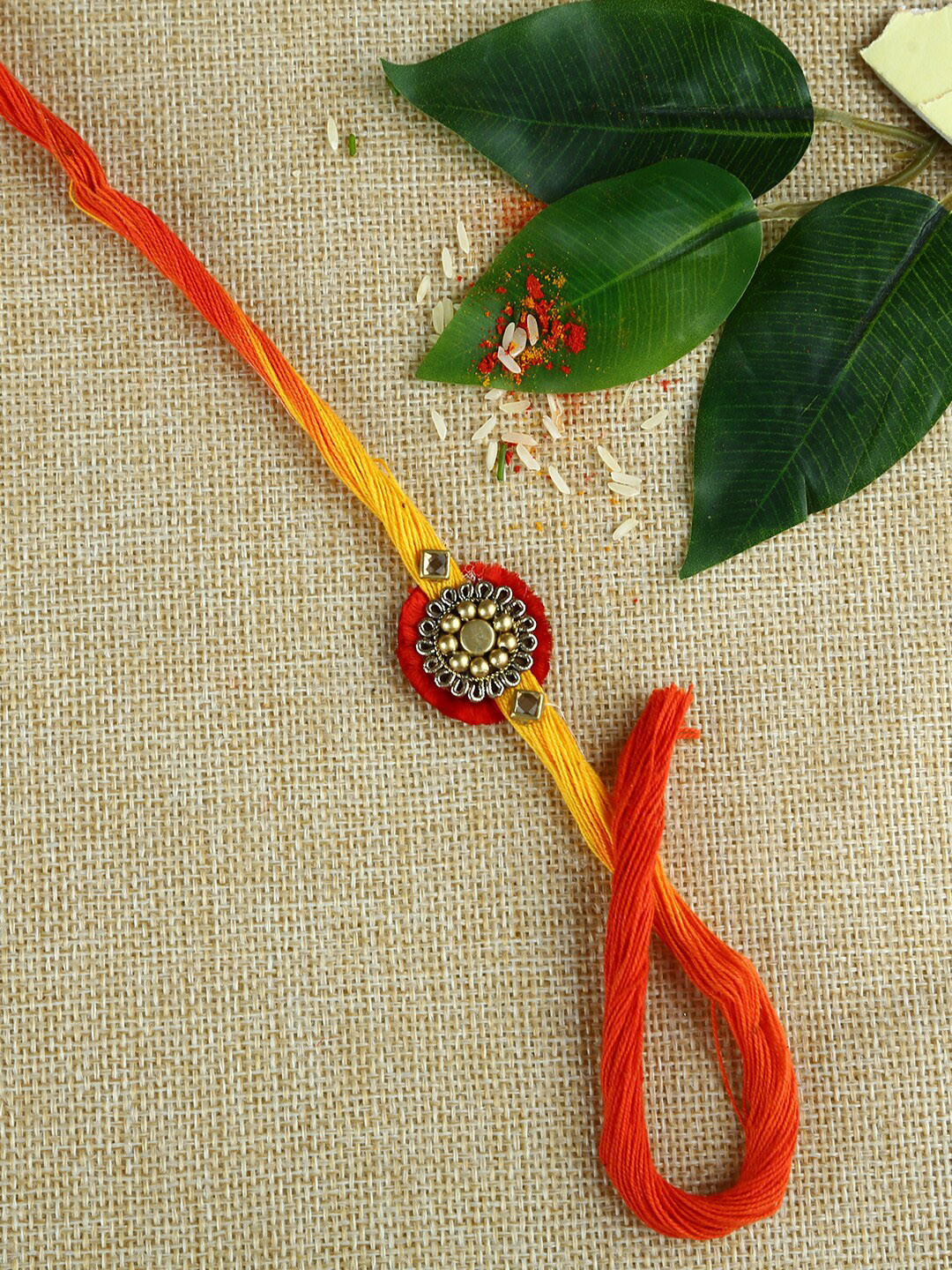 

Aapno Rajasthan Multicoloured Rakhi Gift Set, Gold