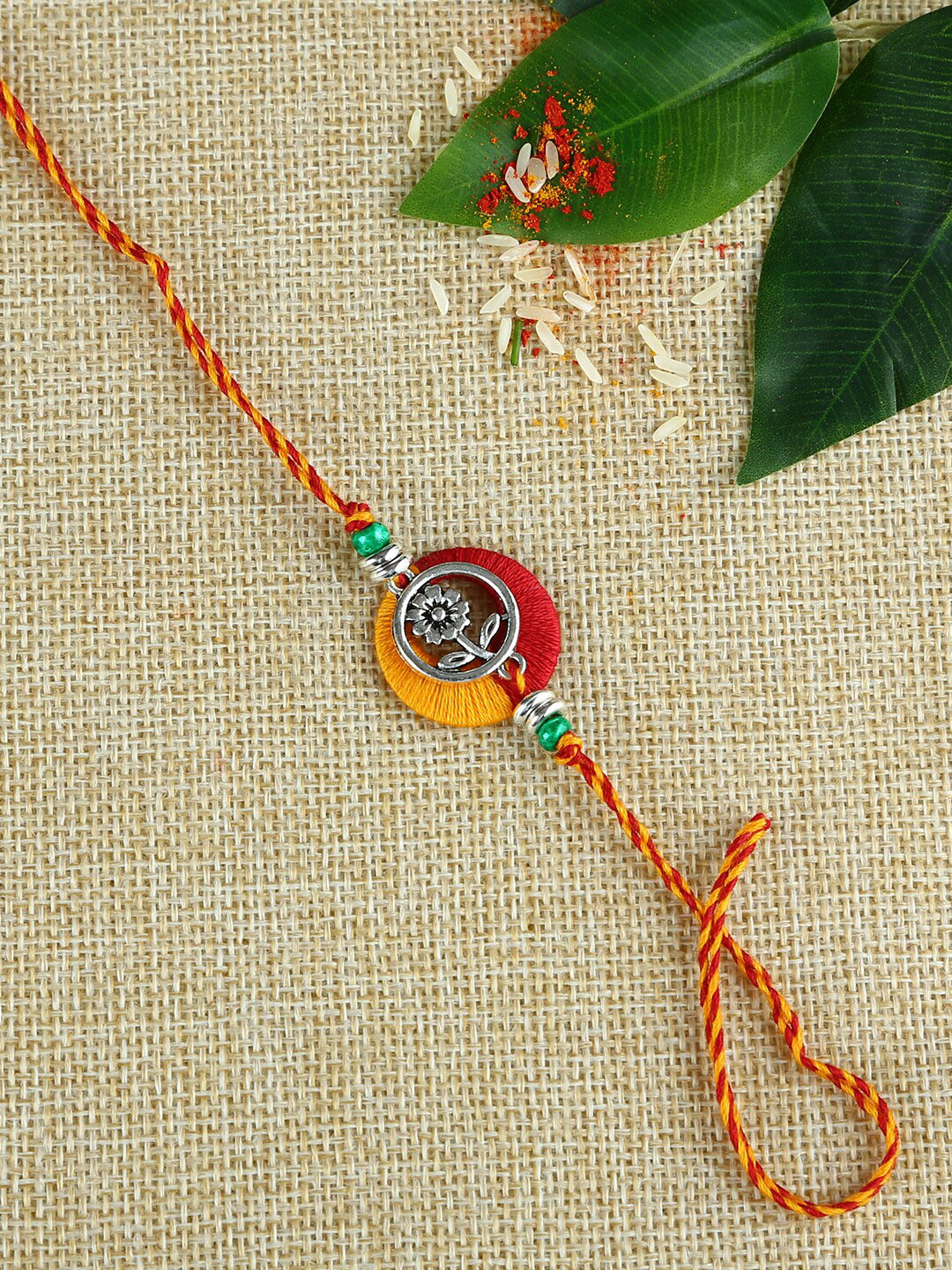 

Aapno Rajasthan Multicoloured Rakhi Gift Set, Red