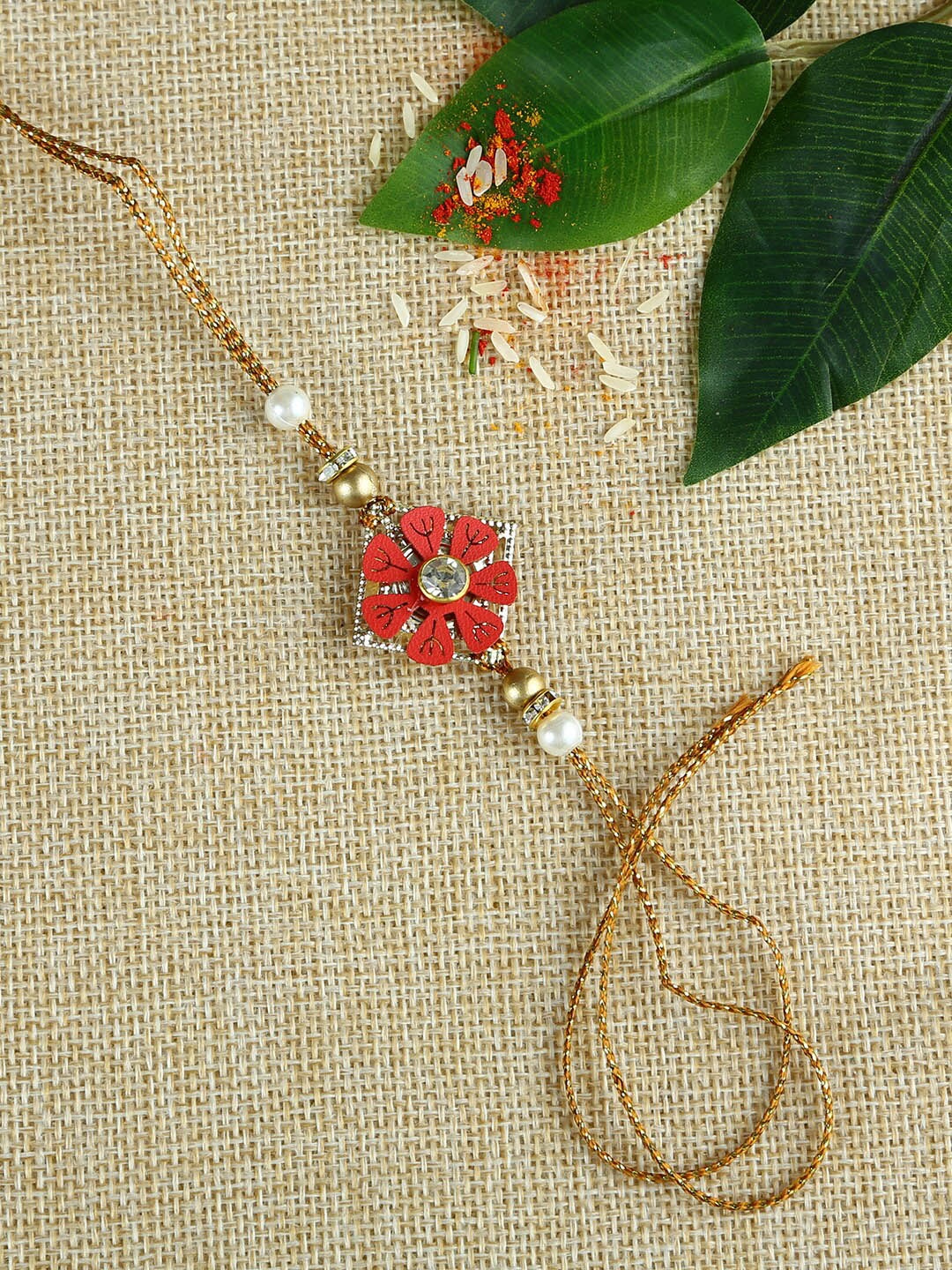 

Aapno Rajasthan Red & Brown Handcrafted Flower Beads-Work Rakhi