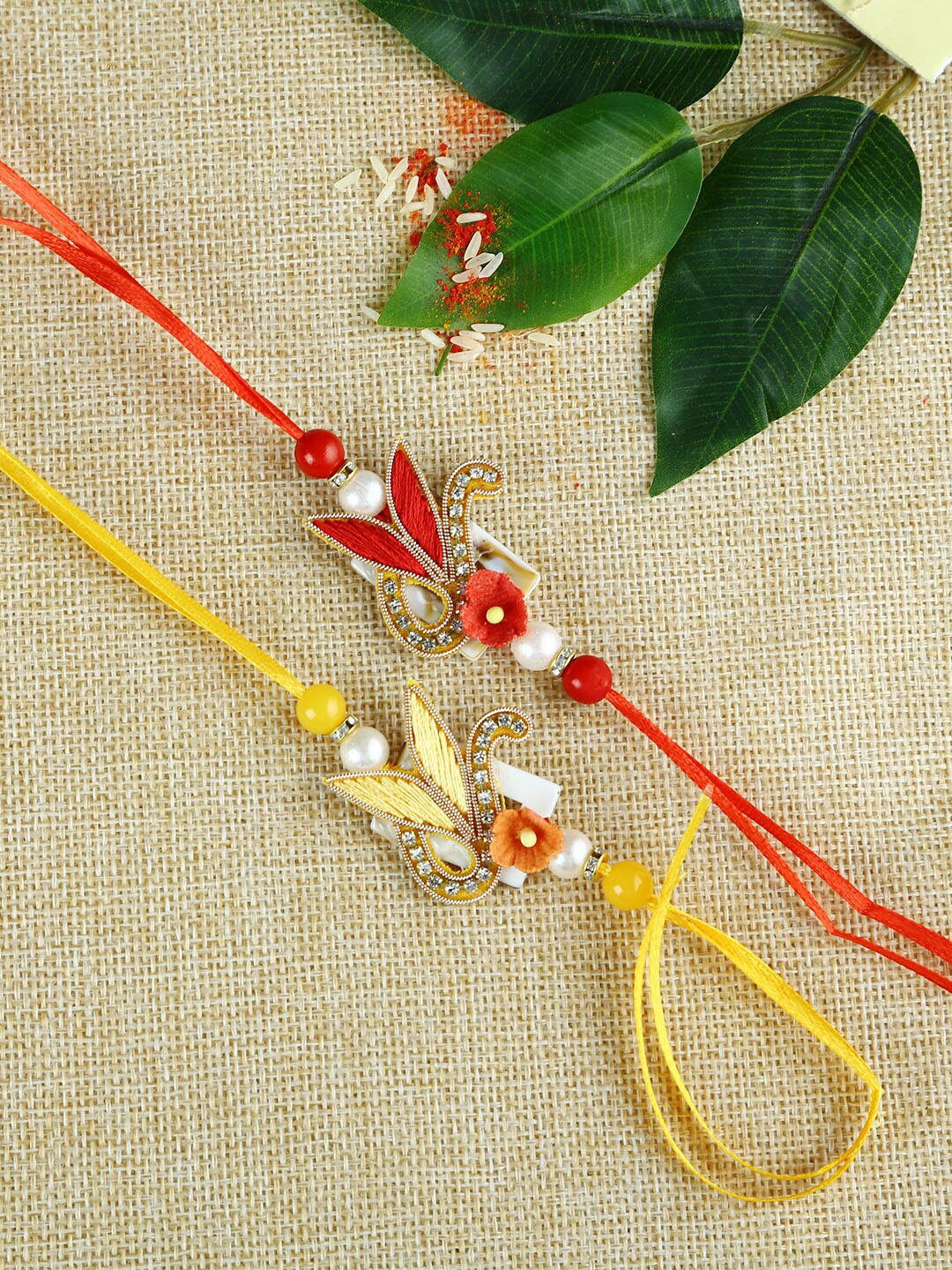 

Aapno Rajasthan Set of 2 Red & Yellow Fabric Traditional Rakhi