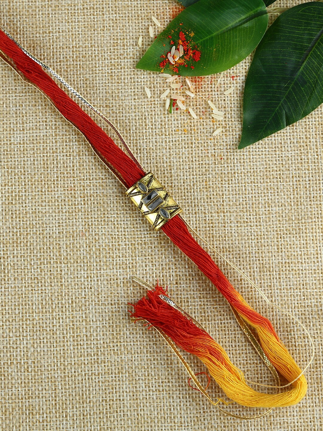 

Aapno Rajasthan Antique Gold-Toned & Red Handcrafted Rakhi