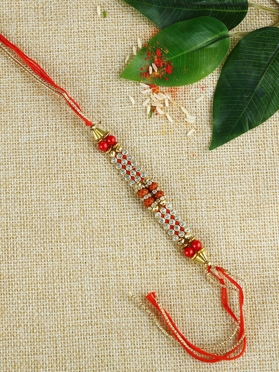 

Aapno Rajasthan Red Handcrafted Auspicious Mauli Rakhi with Beads and Rudraksha