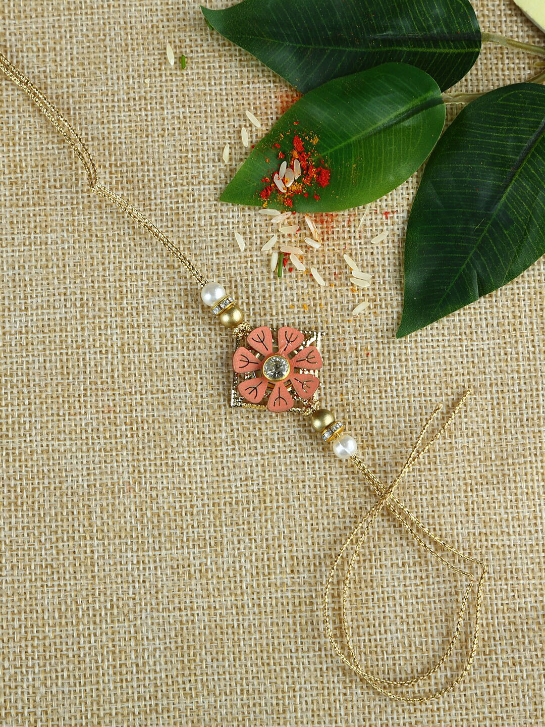 

Aapno Rajasthan Pink & Brown Handcrafted Flower Beads Rakhi