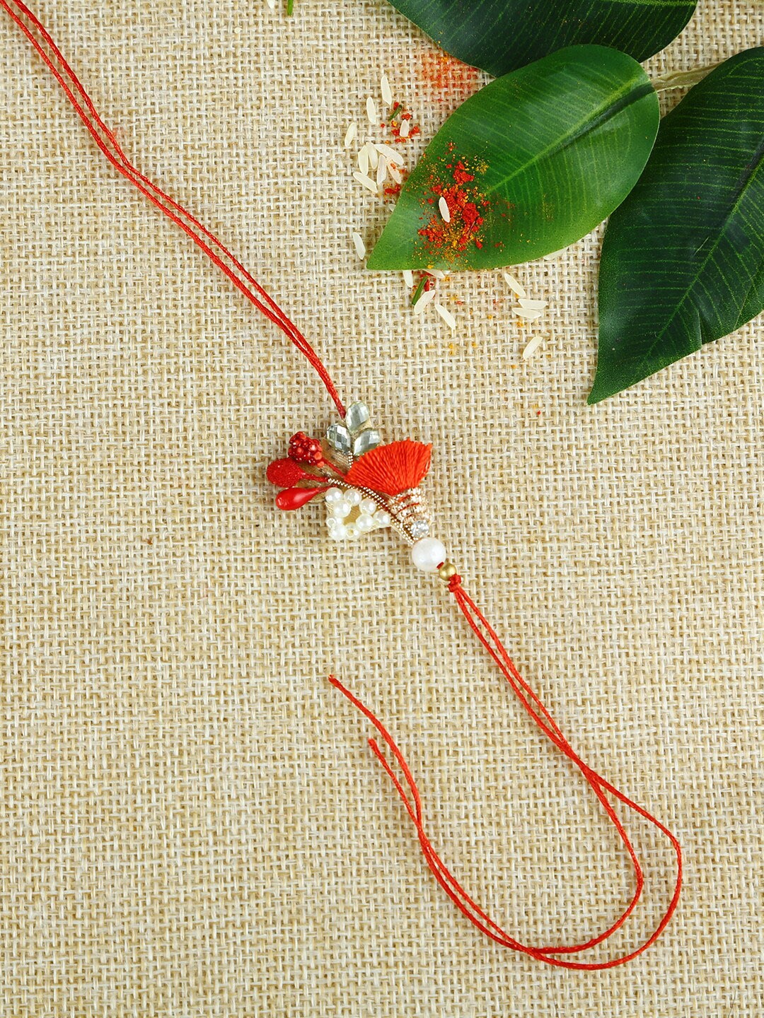 

Aapno Rajasthan Red Themed Stylish Handcrafted Beads Rakhi