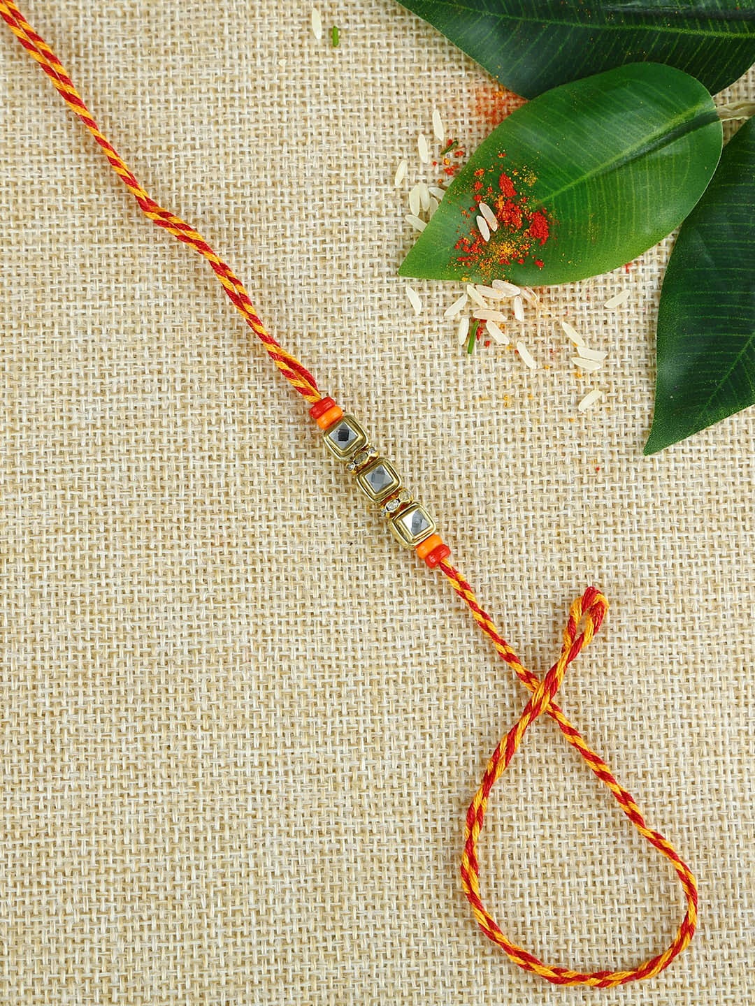 

Aapno Rajasthan Multicoloured Rakhi Gift Set, Gold