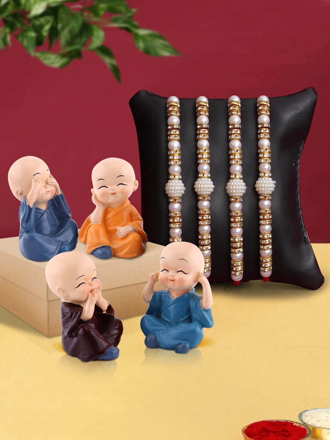 

TIED RIBBONS Set of 4 Pearl Rakhi with 4 Buddha Monk Idol Combo Gift, Multi