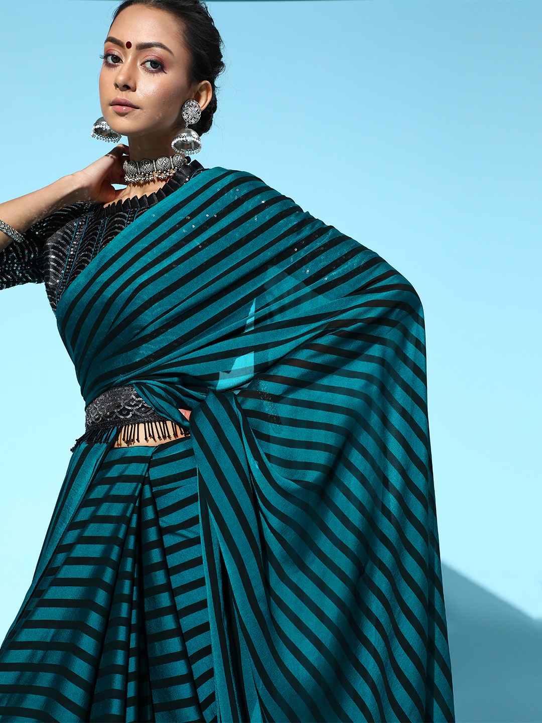 

Saree mall Teal Blue & Black Striped Poly Georgette Party Wear Saree with Matching Blouse