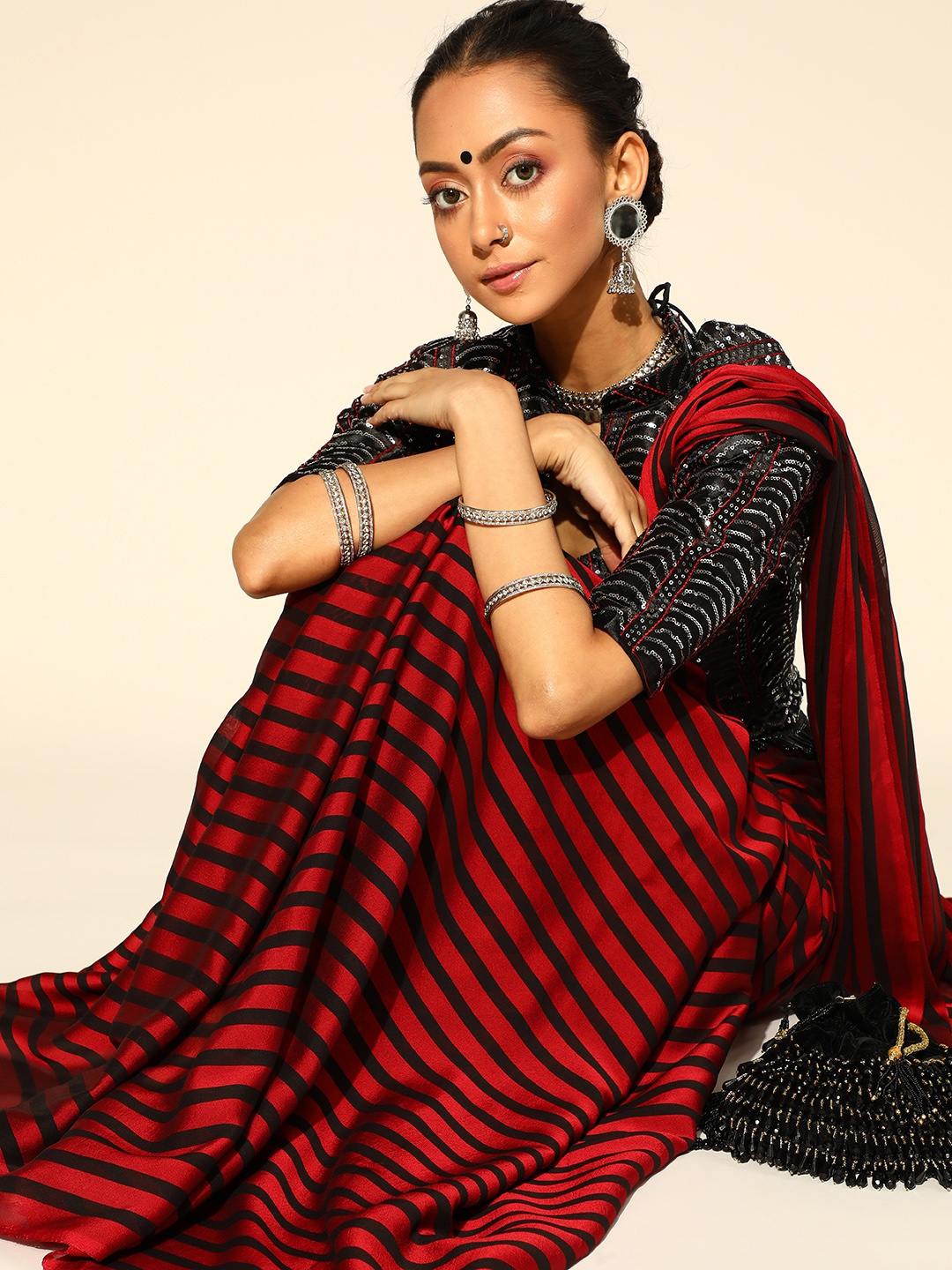 

Saree mall Red & Black Striped Party Wear Poly Georgette Saree with Matching Blouse