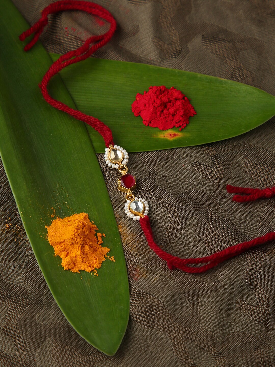 

justpeachy Gold-Toned & Red Rakhi With Roli and Akshada