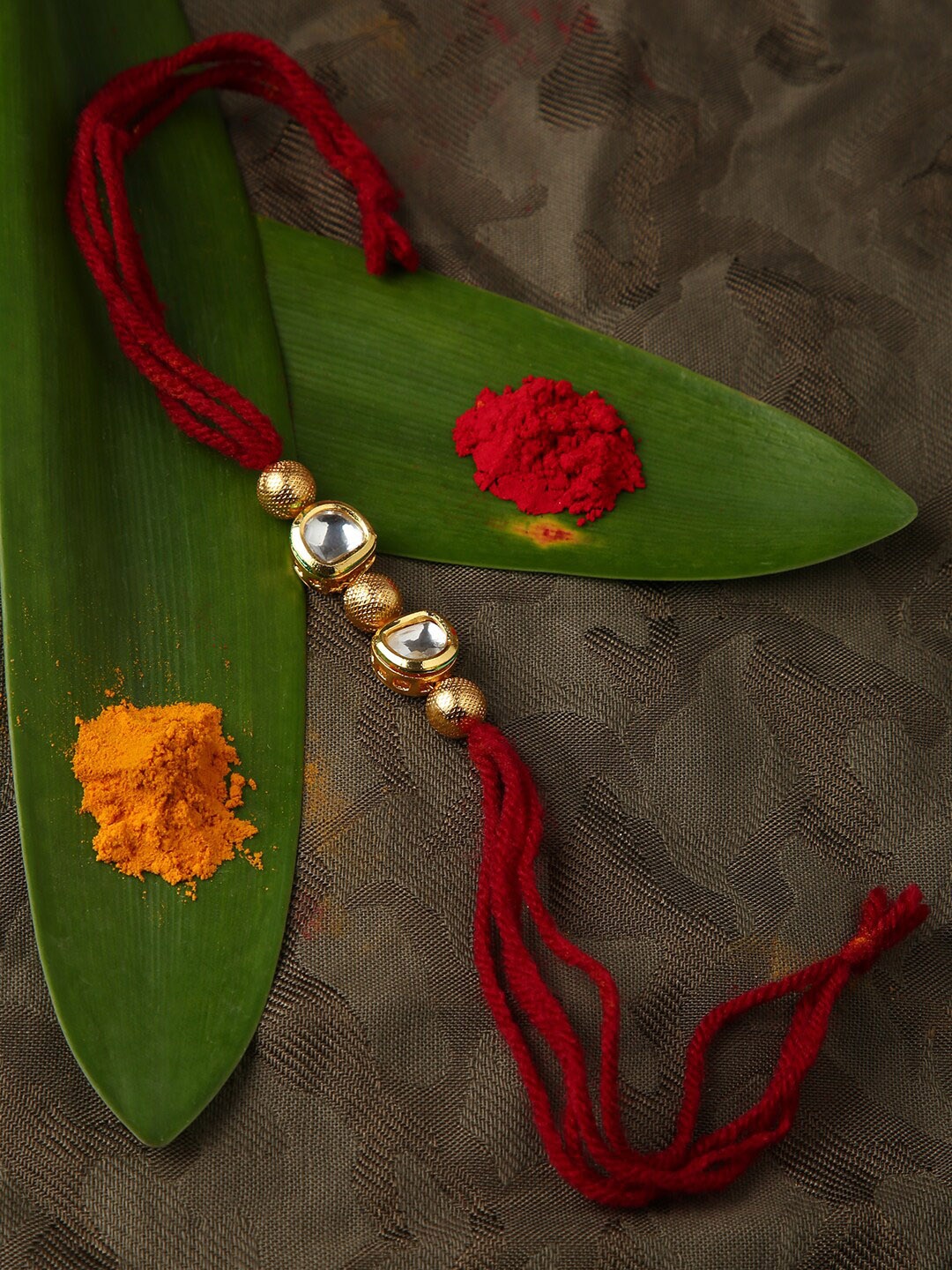 

justpeachy Gold Toned & Red Kundan Rakhi
