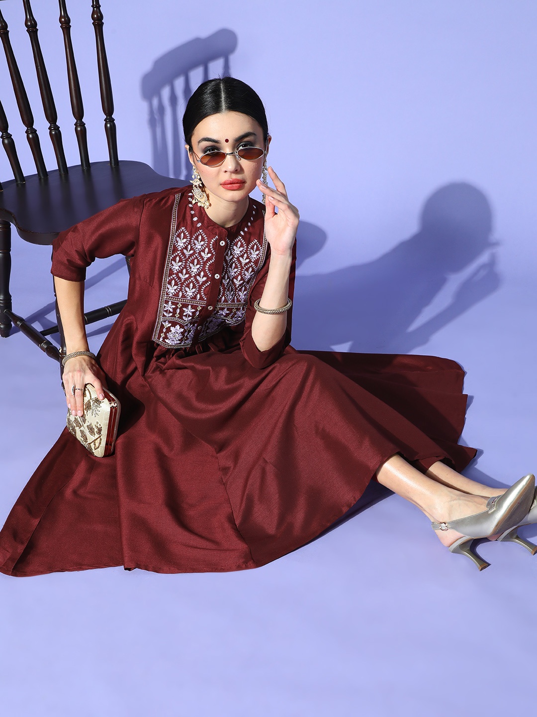 

Sangria Women Maroon Ethnic Motifs Embroidered Yoke Design A-Line Kurta with Trousers