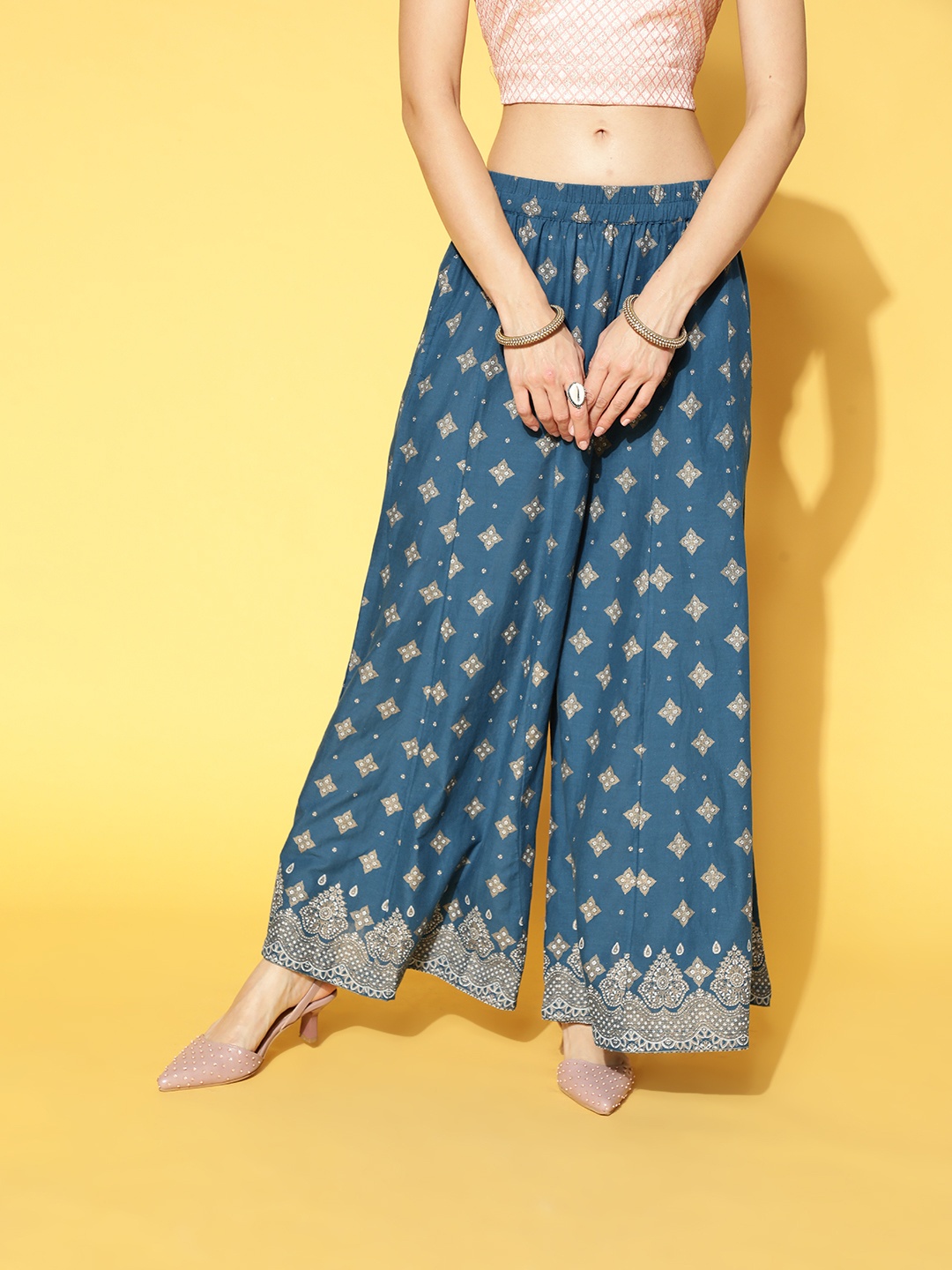 

Sangria Women Teal & Beige Pure Cotton Ethnic Motifs Printed Flared Palazzos