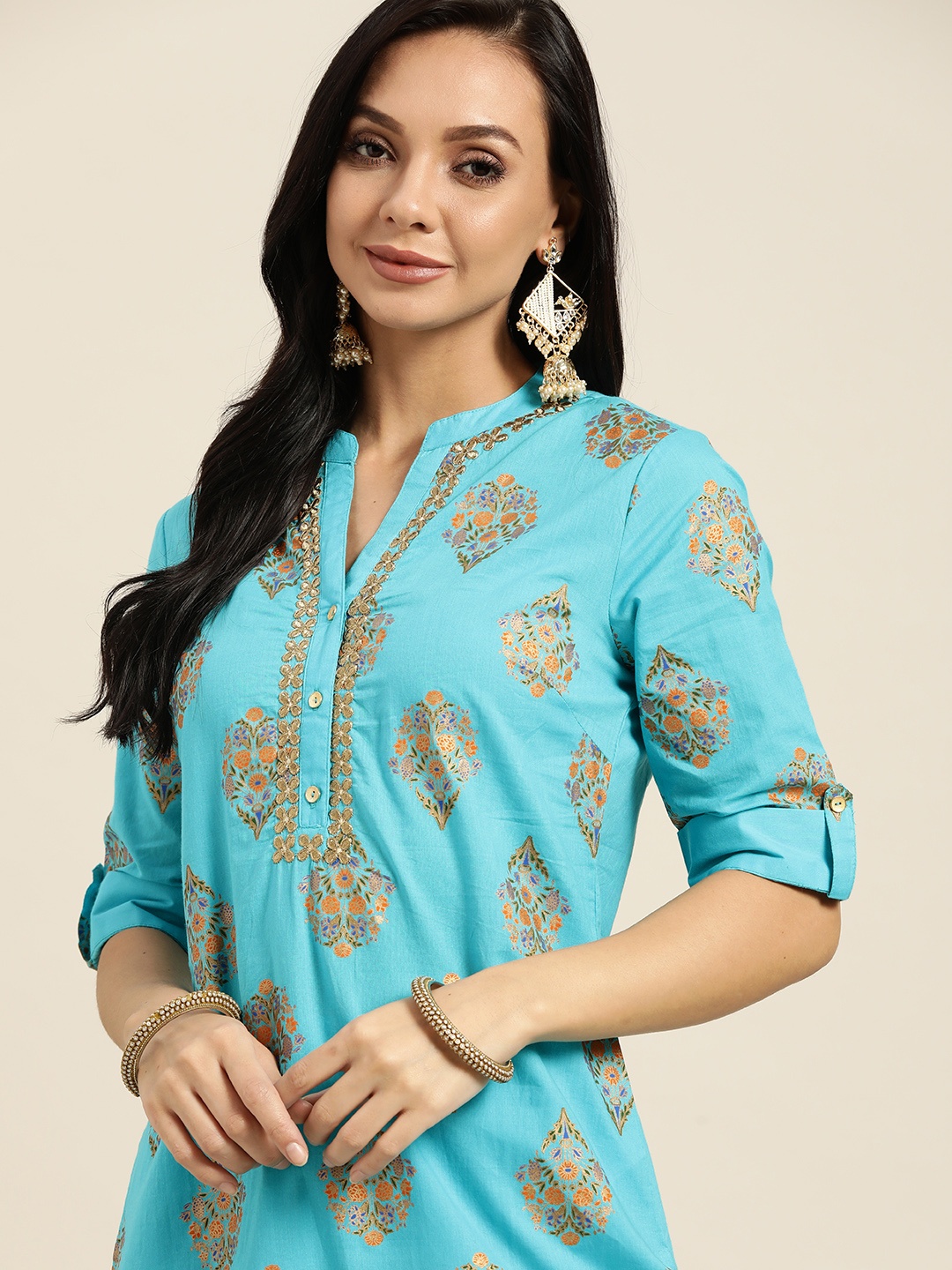 

Sangria Women Turquoise Blue Ethnic Motifs Printed Regular Kurta with Trousers