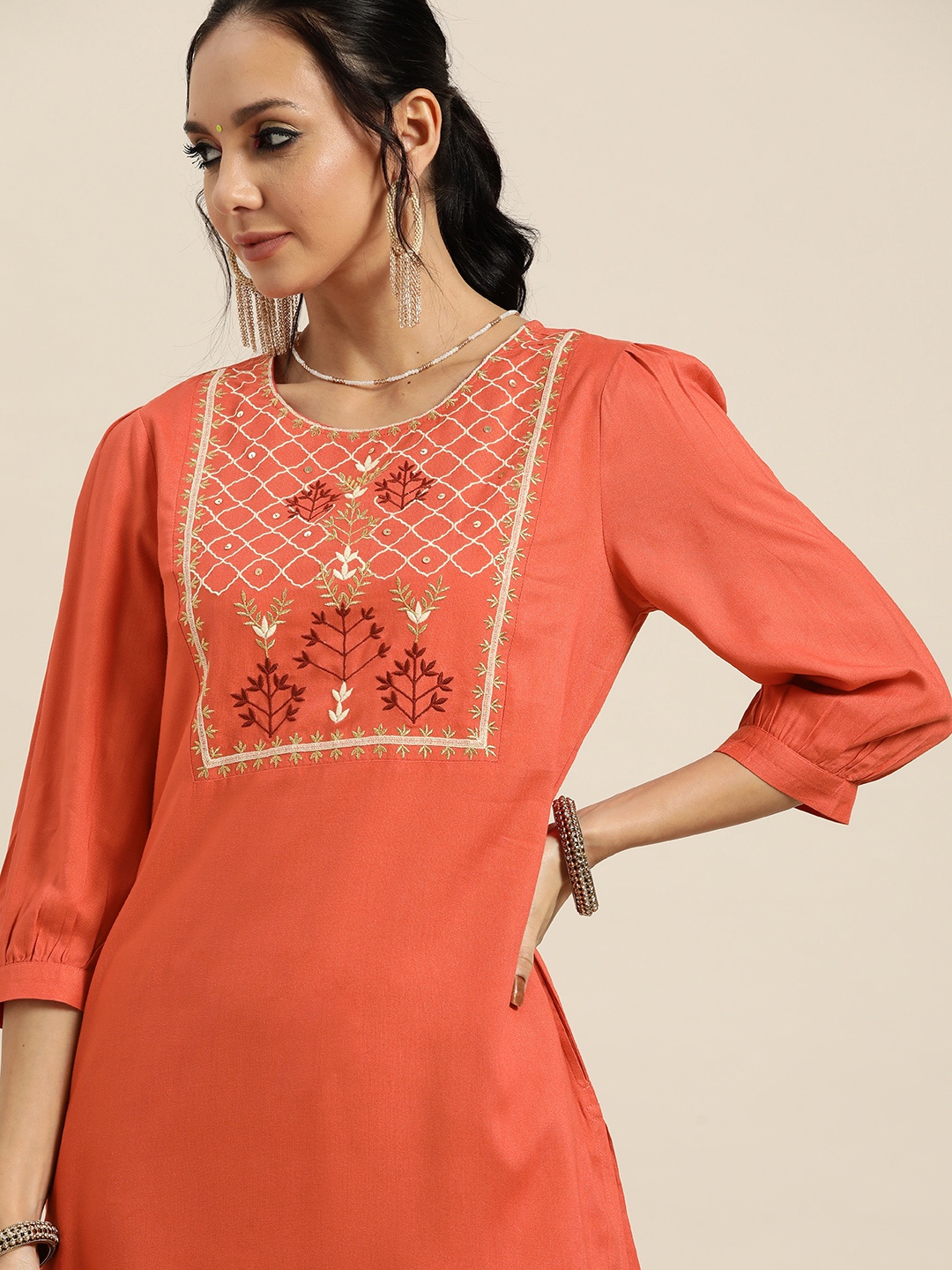 

Sangria Women Orange & Cream-Coloured Ethnic Motifs Yoke Design Thread Work Kurta