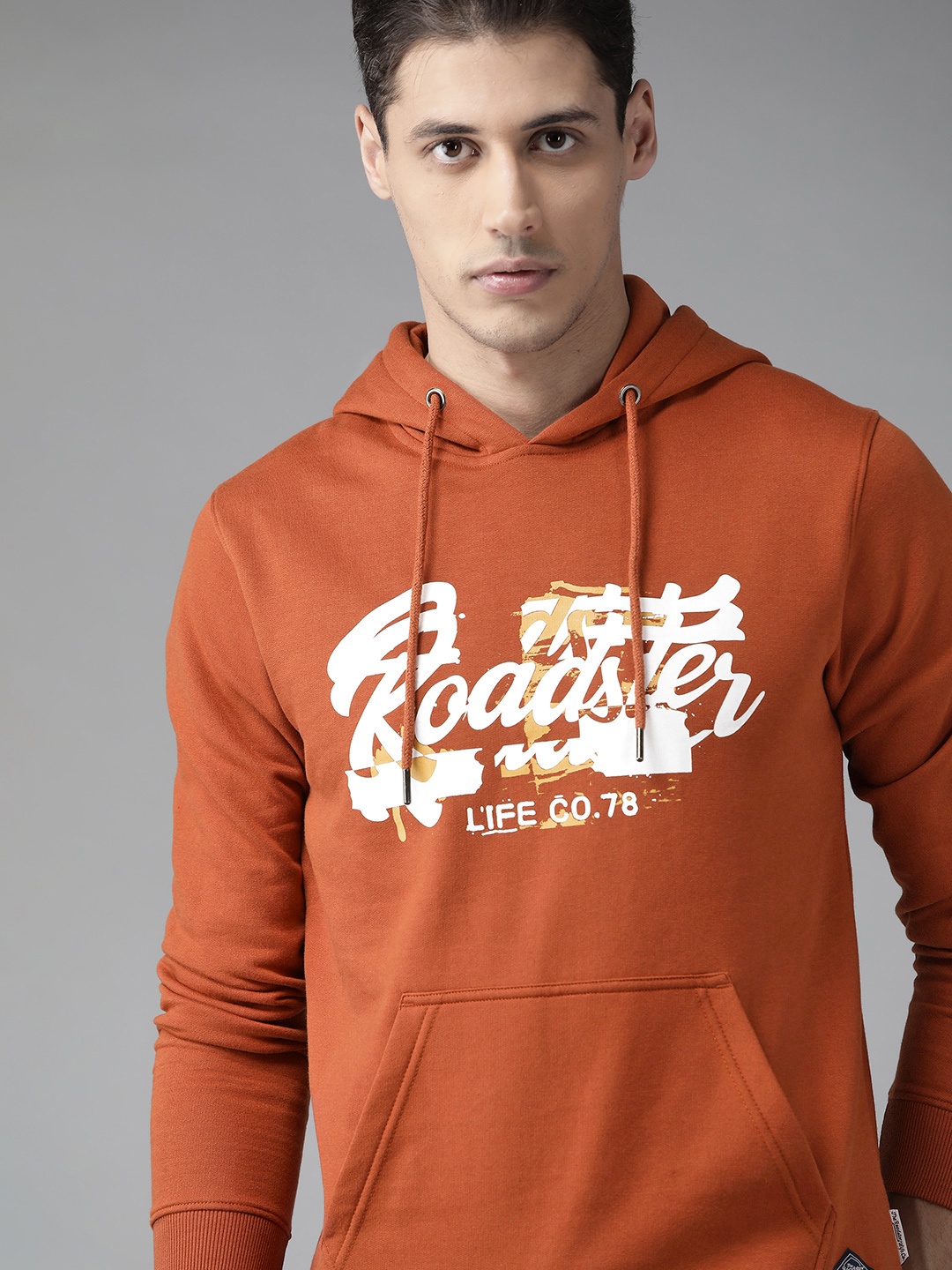 

Roadster Men Rust Orange Brand Logo Print Hooded Sweatshirt