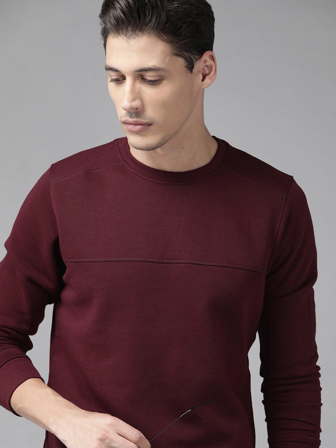 

Roadster Men Burgundy Solid Sweatshirt