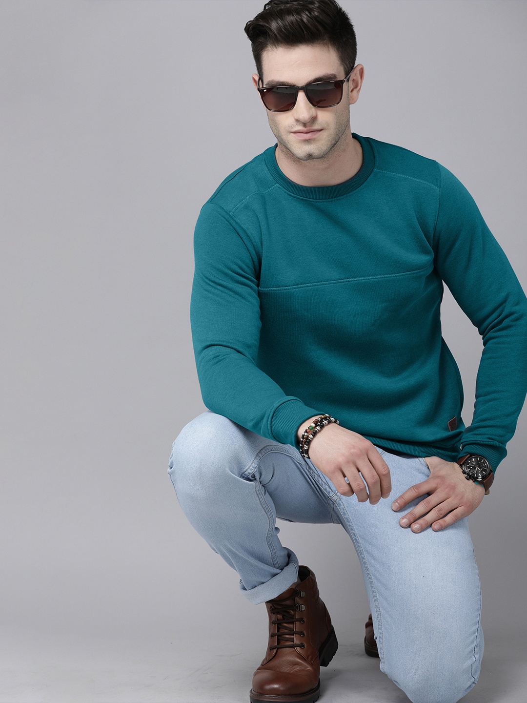 

Roadster Men Teal Blue Solid Sweatshirt