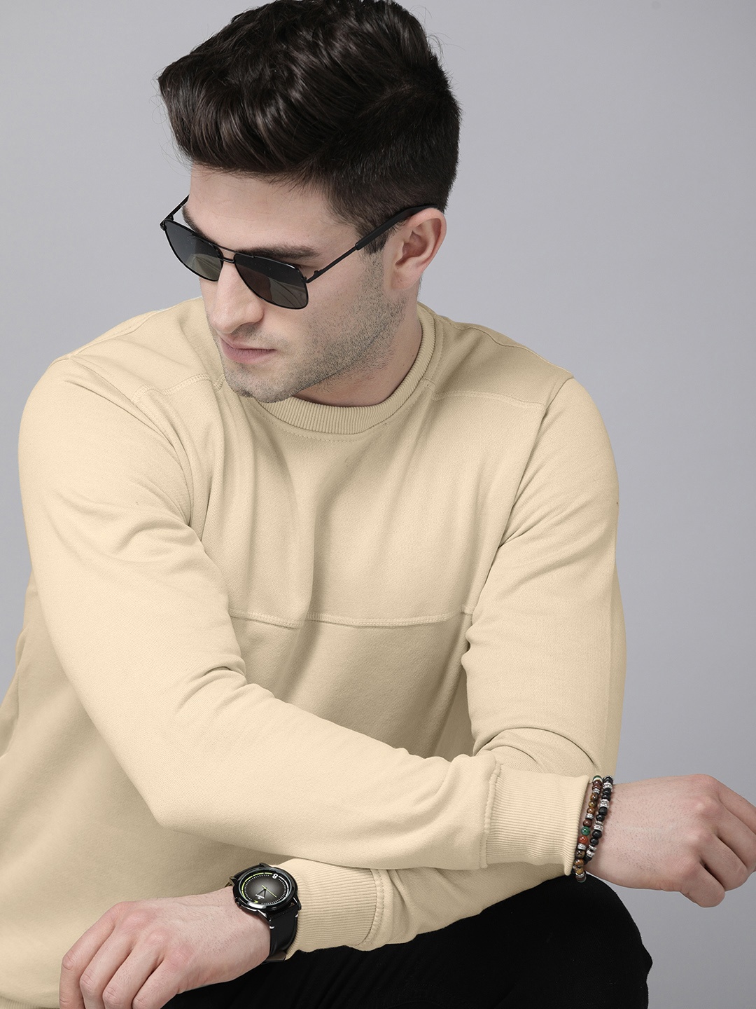 

Roadster Men Beige Solid Sweatshirt