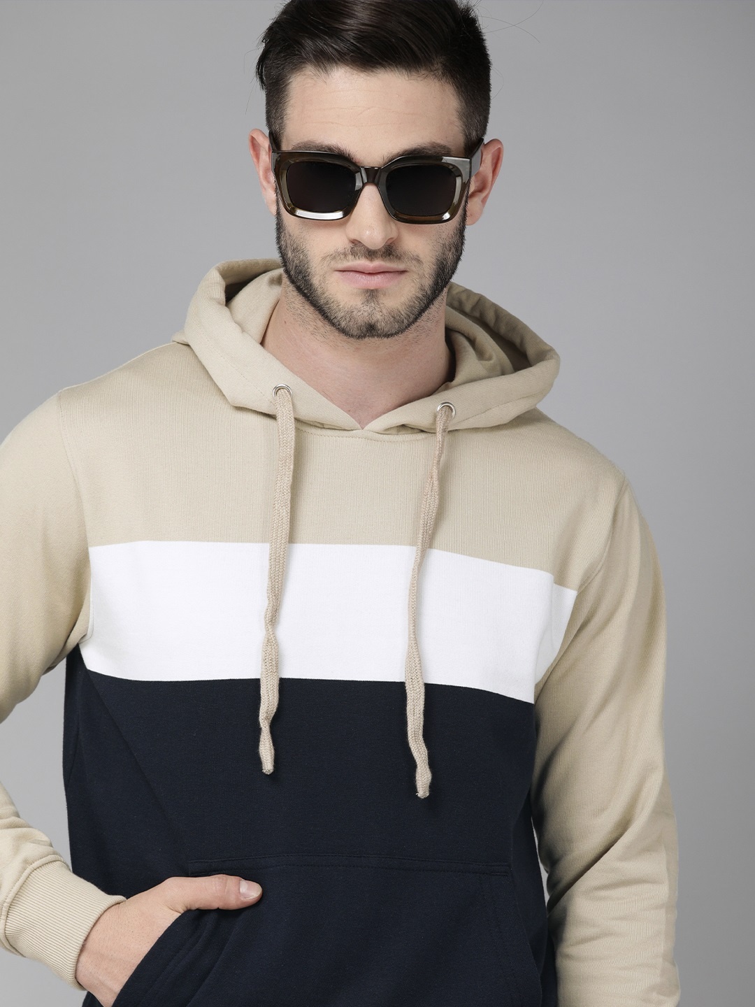 

Roadster Men Beige & Navy Blue Colourblocked Hooded Sweatshirt