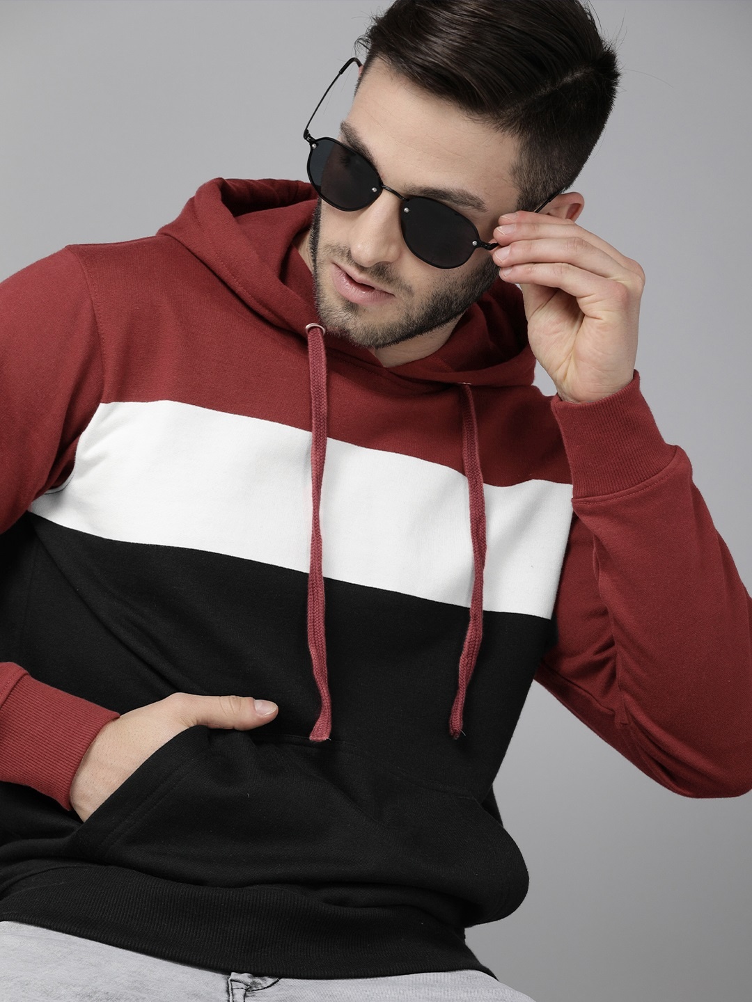 

Roadster Men Maroon & Black Colourblocked Hooded Sweatshirt