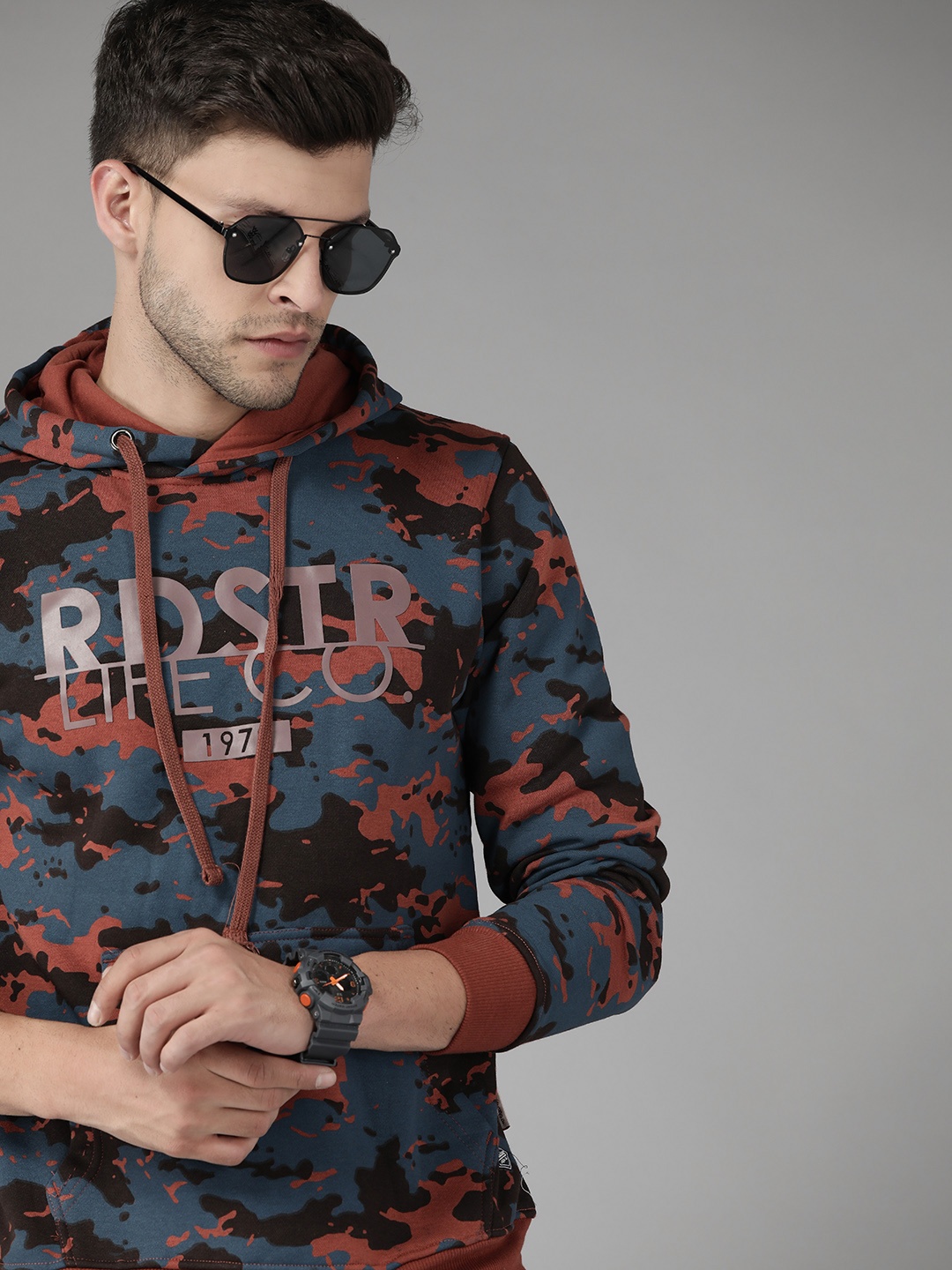 

Roadster Men Blue & Rust Red Printed Hooded Sweatshirt