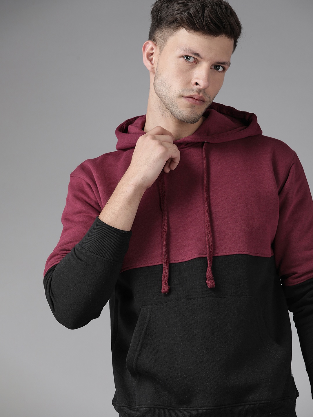 

Roadster Men Burgundy & Black Colourblocked Hooded Sweatshirt