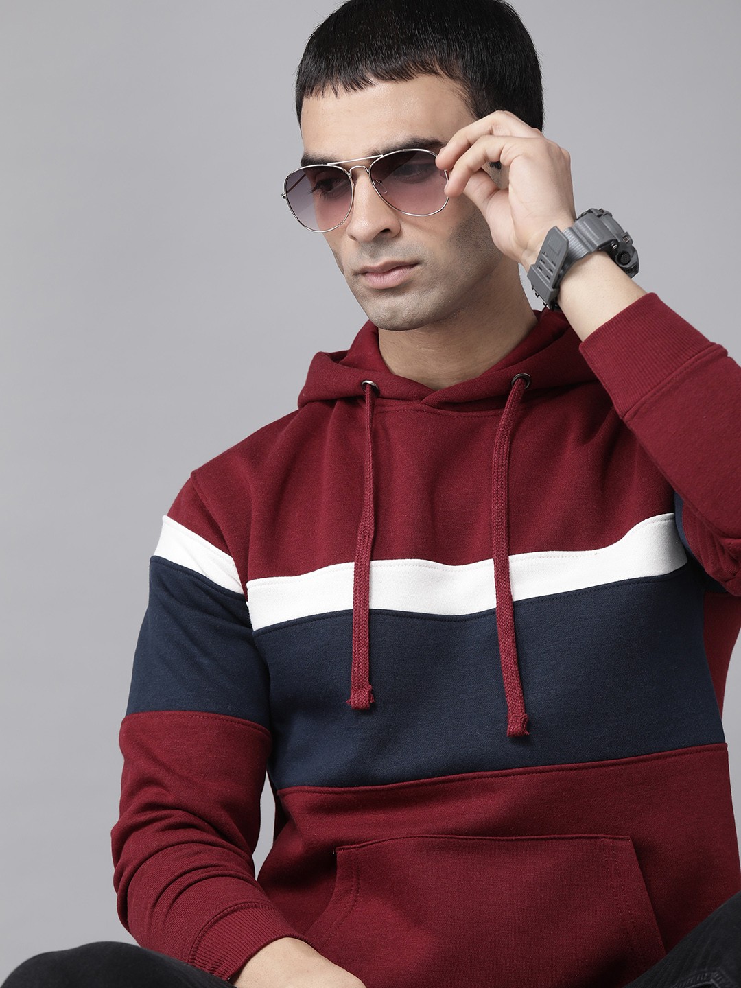 

Roadster Men Maroon & Navy Striped Hooded Sweatshirt