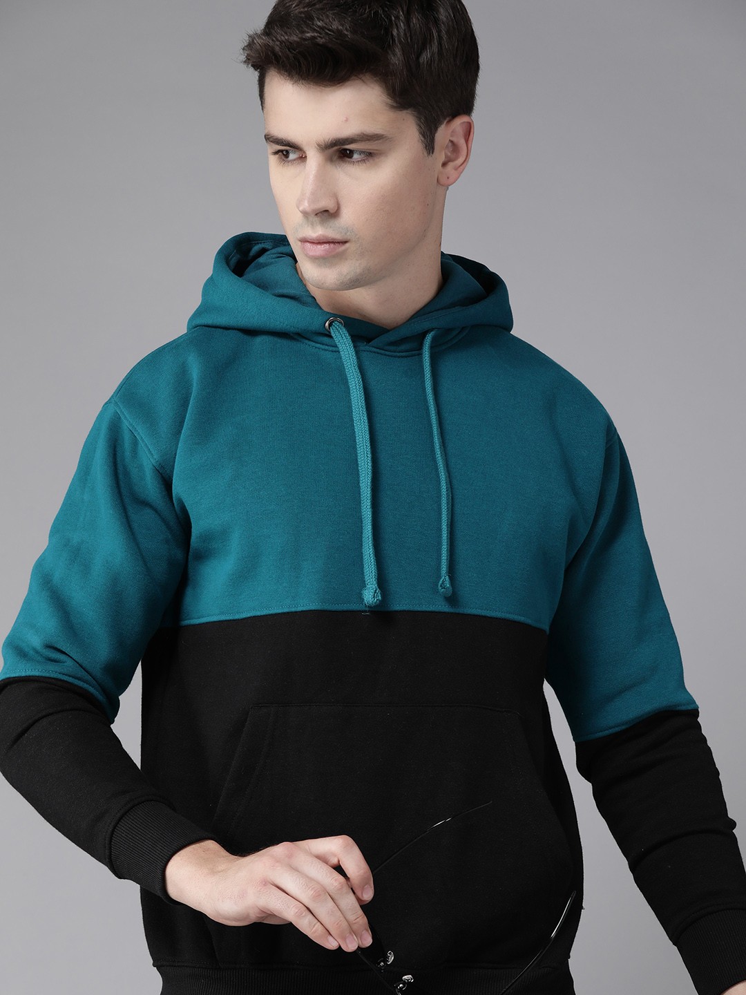 

Roadster Men Teal Blue & Black Colourblocked Hooded Sweatshirt