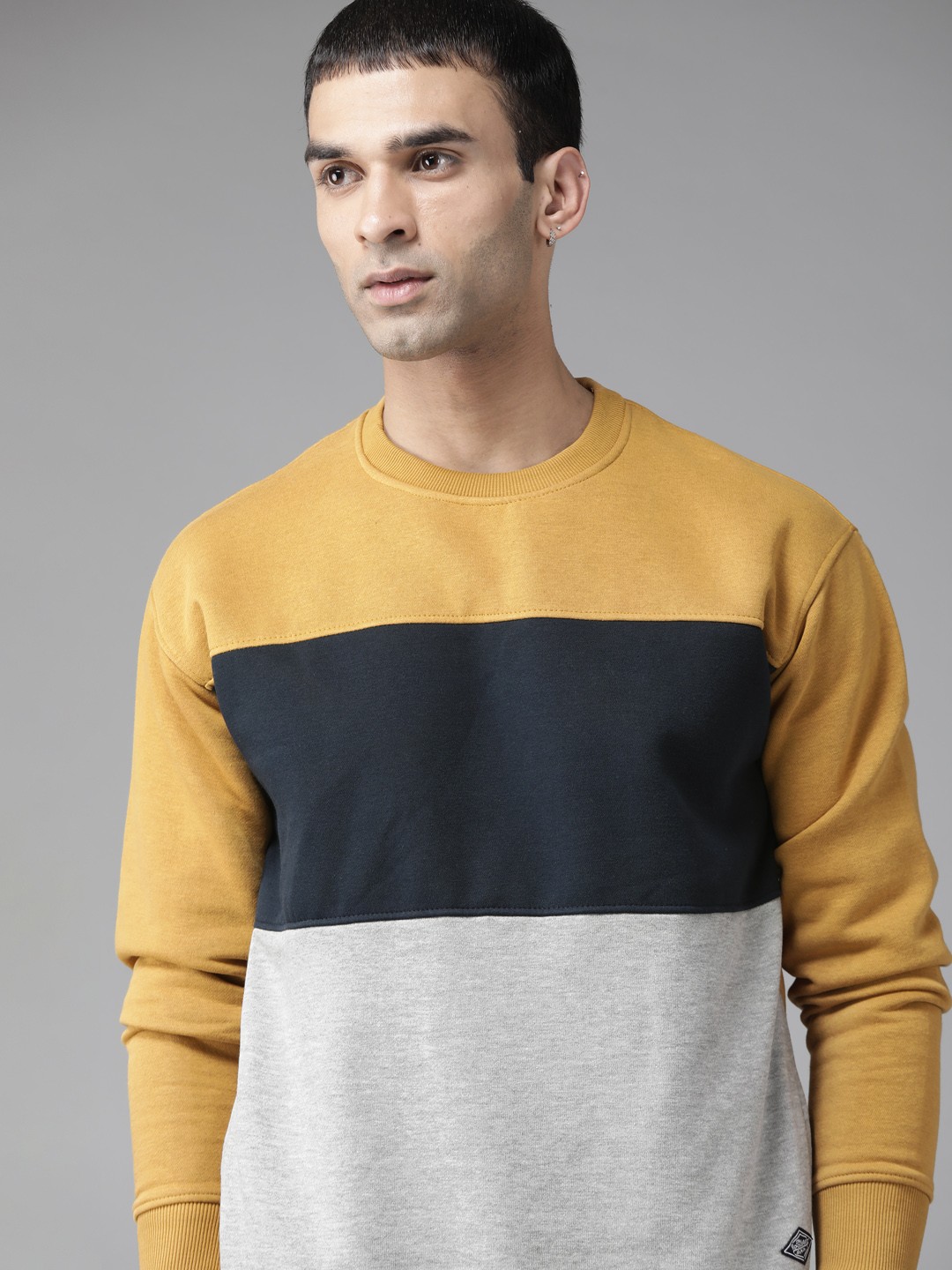 

Roadster Men Mustard Brown & Grey Melange Colourblocked Sweatshirt