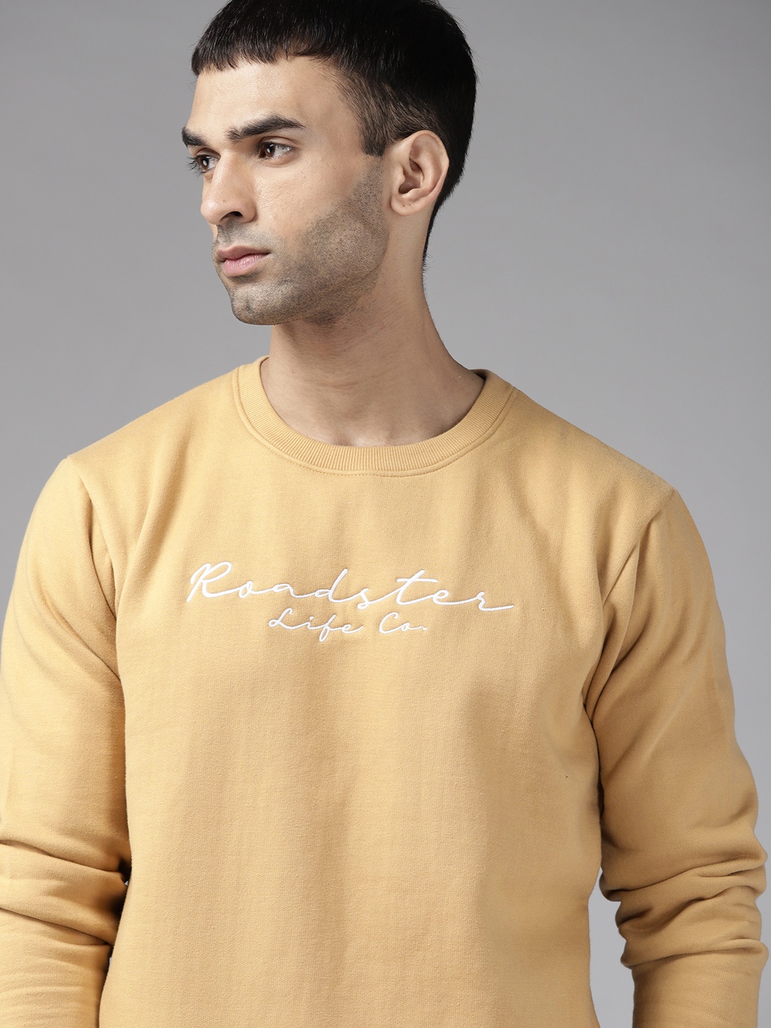 

Roadster Men Mustard Yellow & White Brand Logo Print Sweatshirt